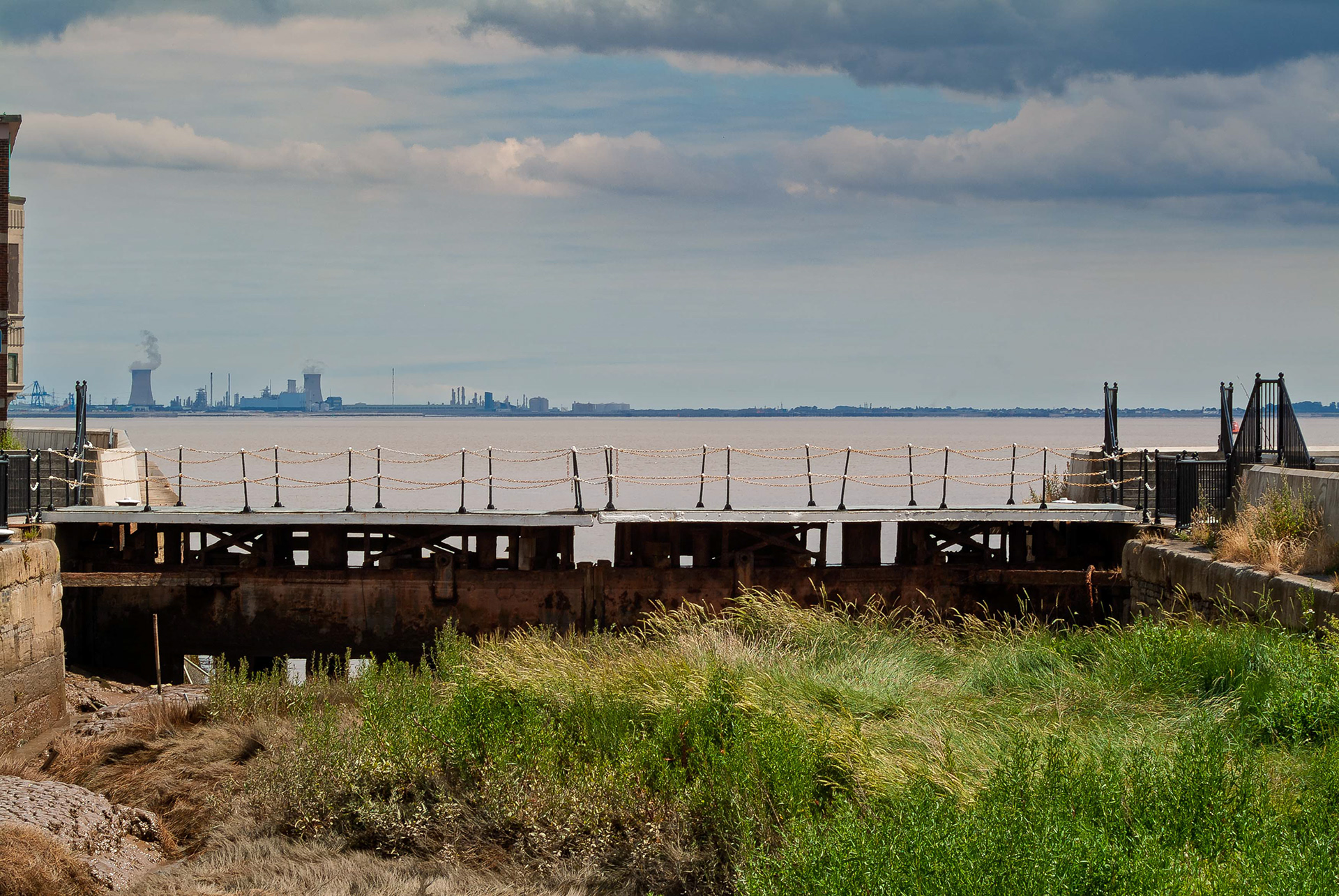 Ref: St Andrews Dock 20050726_4625. St Andrews Dock, Kingston Upon Hull, East Yorkshire, United Kingdom, 26 July, 2005. Pictured: Outer Lock Gates. Derelict dock and buildings of the former home to Hull’s Fishing Industry, St Andrews Dock. The dock closed to shipping in 1975, and the remaining dockside buildings are now gone or in a state of decay. 26 July 2005.