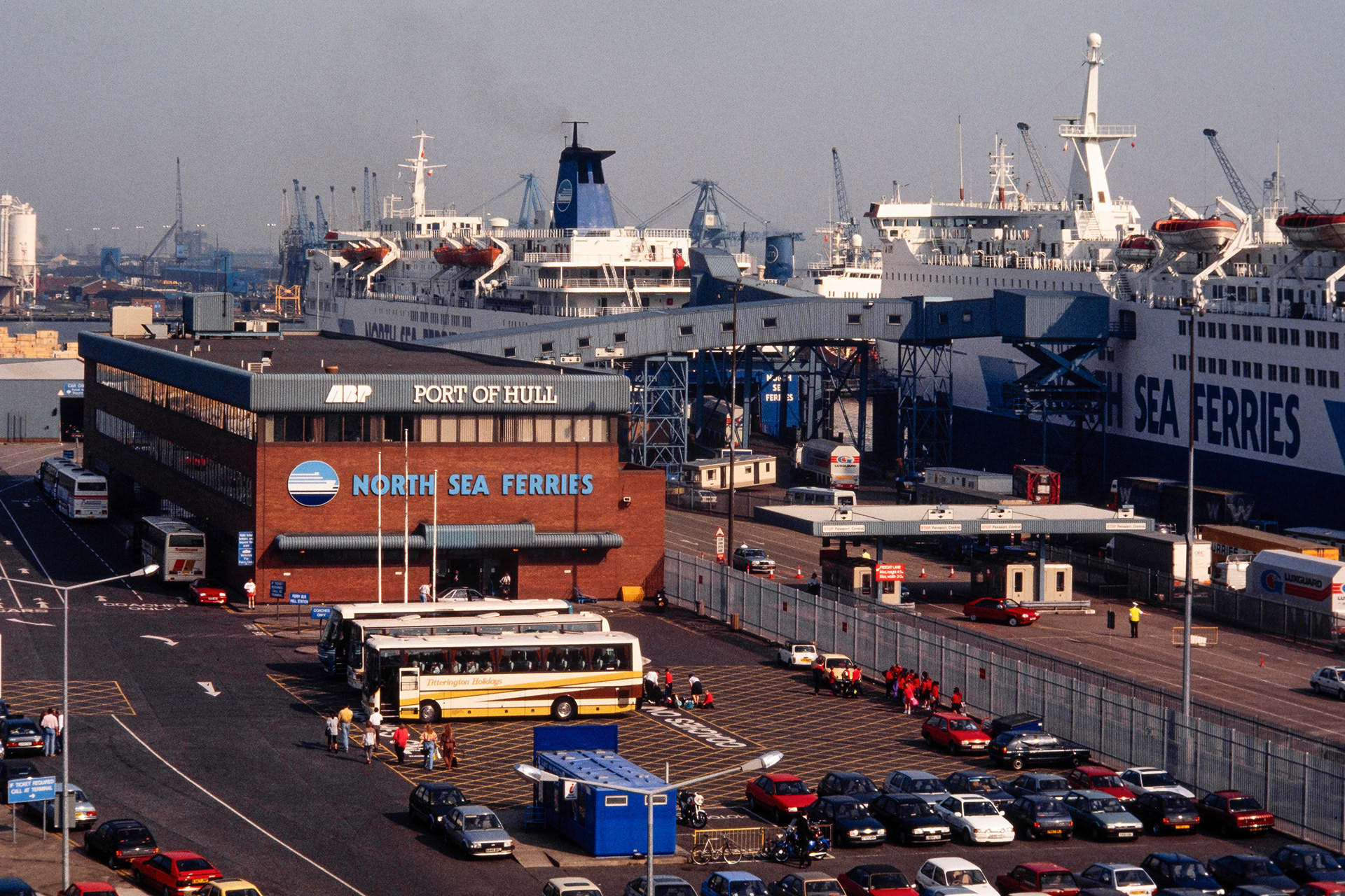 Ref: North Sea Ferries_19930701_2343. King George Dock, Kingston Upon Hull, East Yorkshire, United Kingdom, Circa 1993. Pictured: Vehicles waiting to board North Sea Ferry Ships Norsun and Norland.