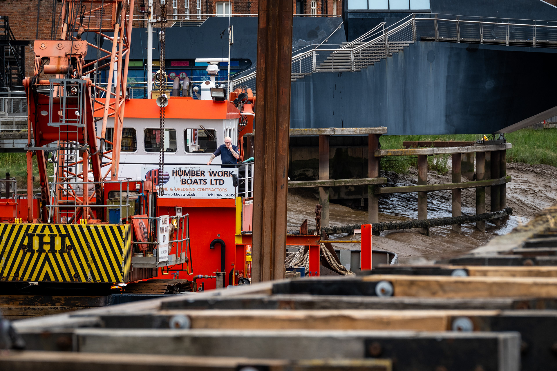 Ref: Hull_20230718_0099. Humber Work Boats repairing wooden defences on the River Hull, Kingston Upon Hull, East Yorkshire, United Kingdom, 18 July 2023.
