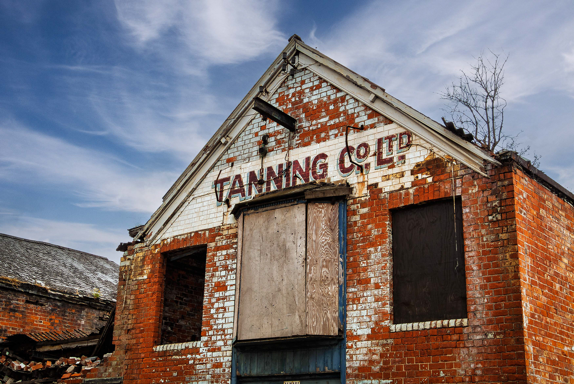 St Andrews Dock_20050726_4688_edit. St Andrews Dock, Kingston Upon Hull, East Yorkshire, United Kingdom, 26 July, 2005. Pictured: The Derelict Tanning Co Ltd, dock and buildings of the former home to Hull’s Fishing Industry, St Andrews Dock. The dock closed to shipping in 1975, and the remaining dockside buildings are now gone or in a state of decay.