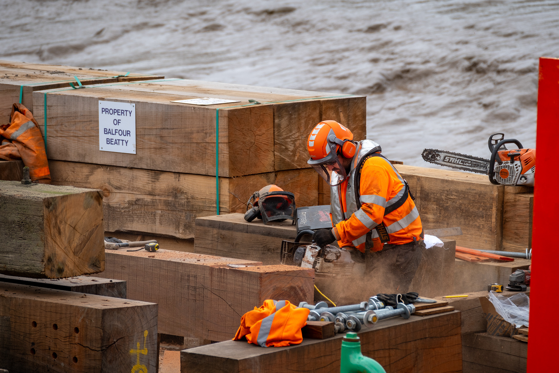 Ref: Hull_20230718_0077. Humber Work Boats repairing wooden defences on the River Hull, Kingston Upon Hull, East Yorkshire, United Kingdom, 18 July 2023.