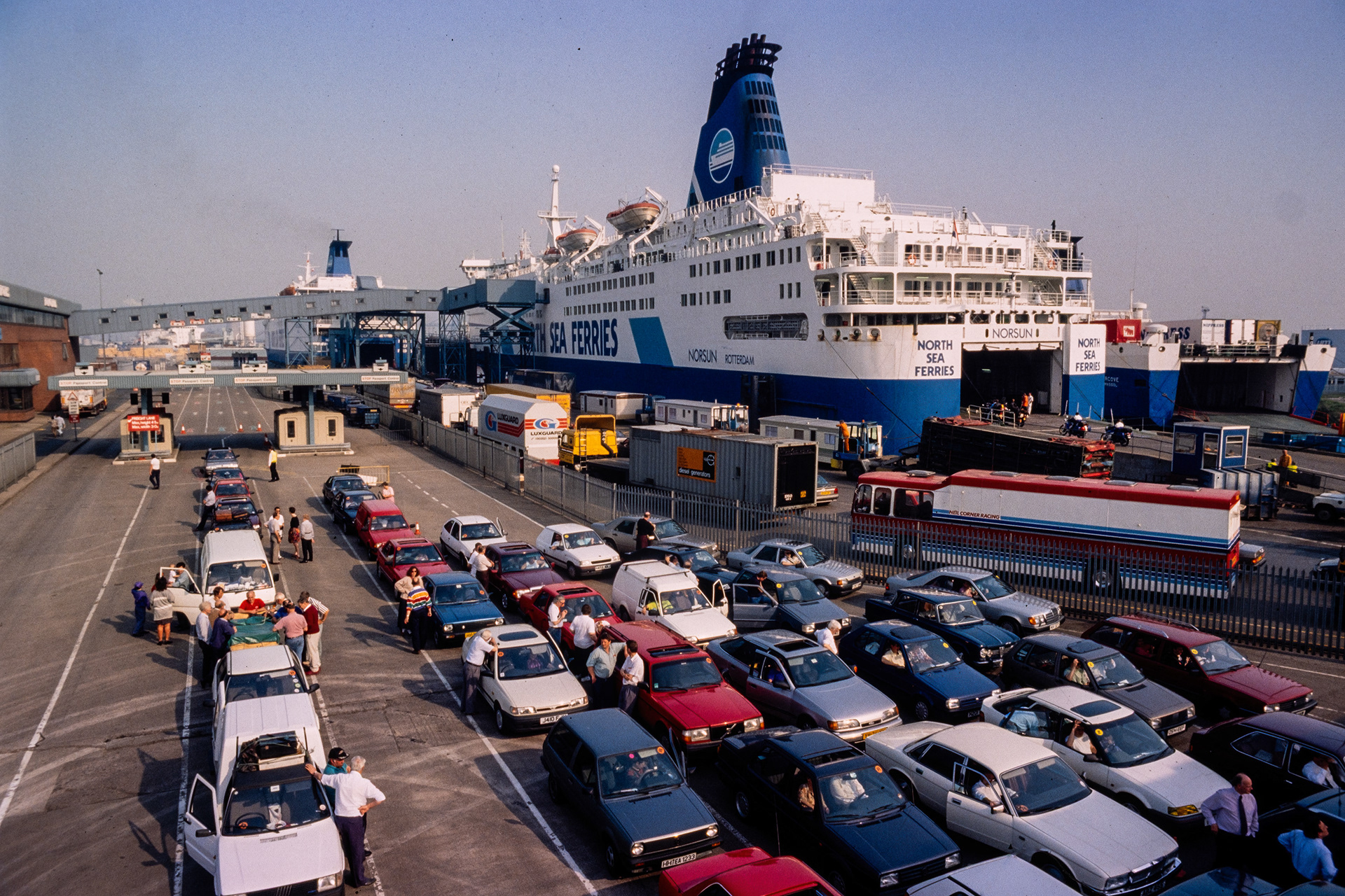 Ref: North Sea Ferries_19930701_2294. King George Dock, Kingston Upon Hull, East Yorkshire, United Kingdom, Circa 1993. Pictured: Vehicles waiting to board North Sea Ferry Ships Norsun and Norland.