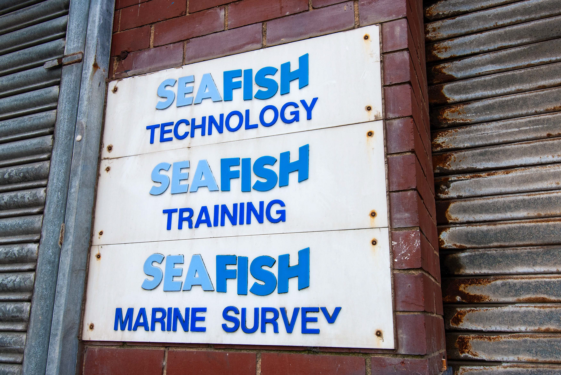 Ref: nh_20070512_2274. St Andrews Dock, Kingston Upon Hull, East Yorkshire, United Kingdom, 26 July, 2005. Pictured: Derelict dock and buildings of the former home to Hull’s Fishing Industry, St Andrews Dock. The dock closed to shipping in 1975, and the remaining dockside buildings are now gone or in a state of decay. May 12, 2007.
