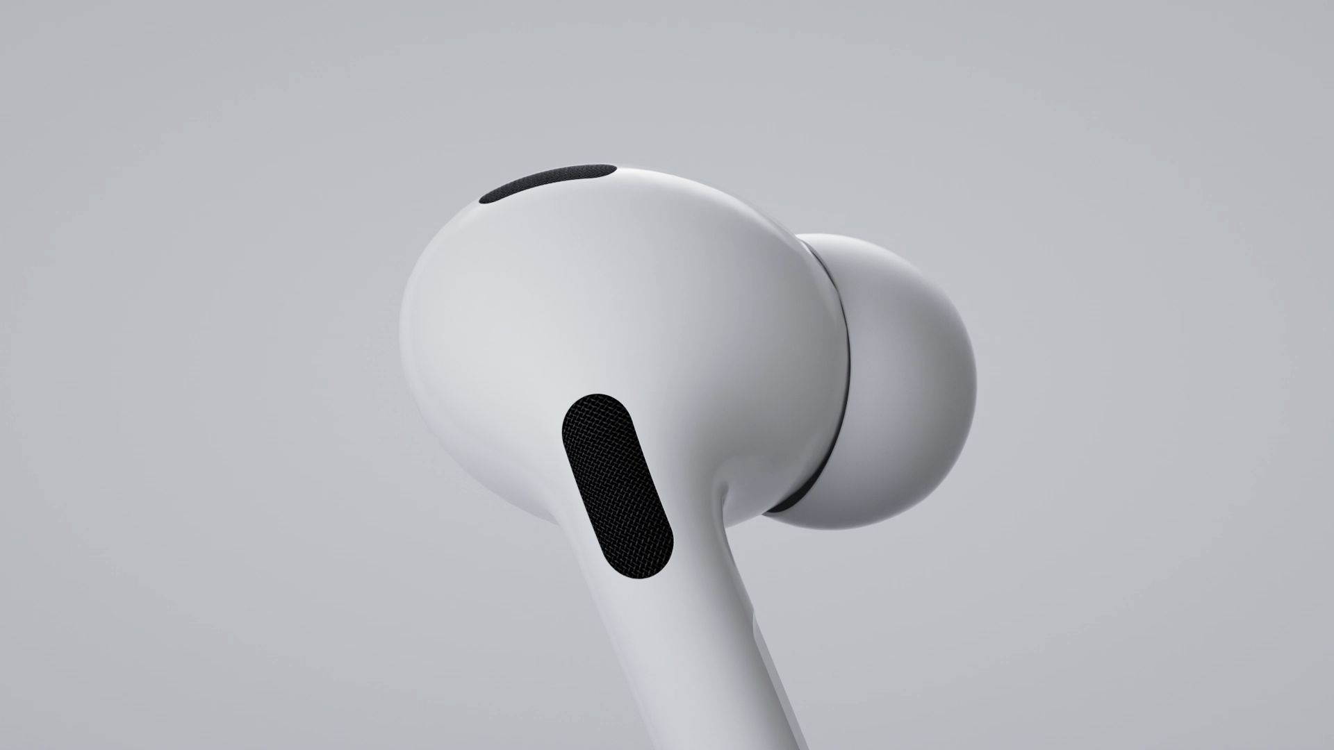Close-up of white in-ear wireless earbuds showing the black speaker grilles, floating against a light grey background.