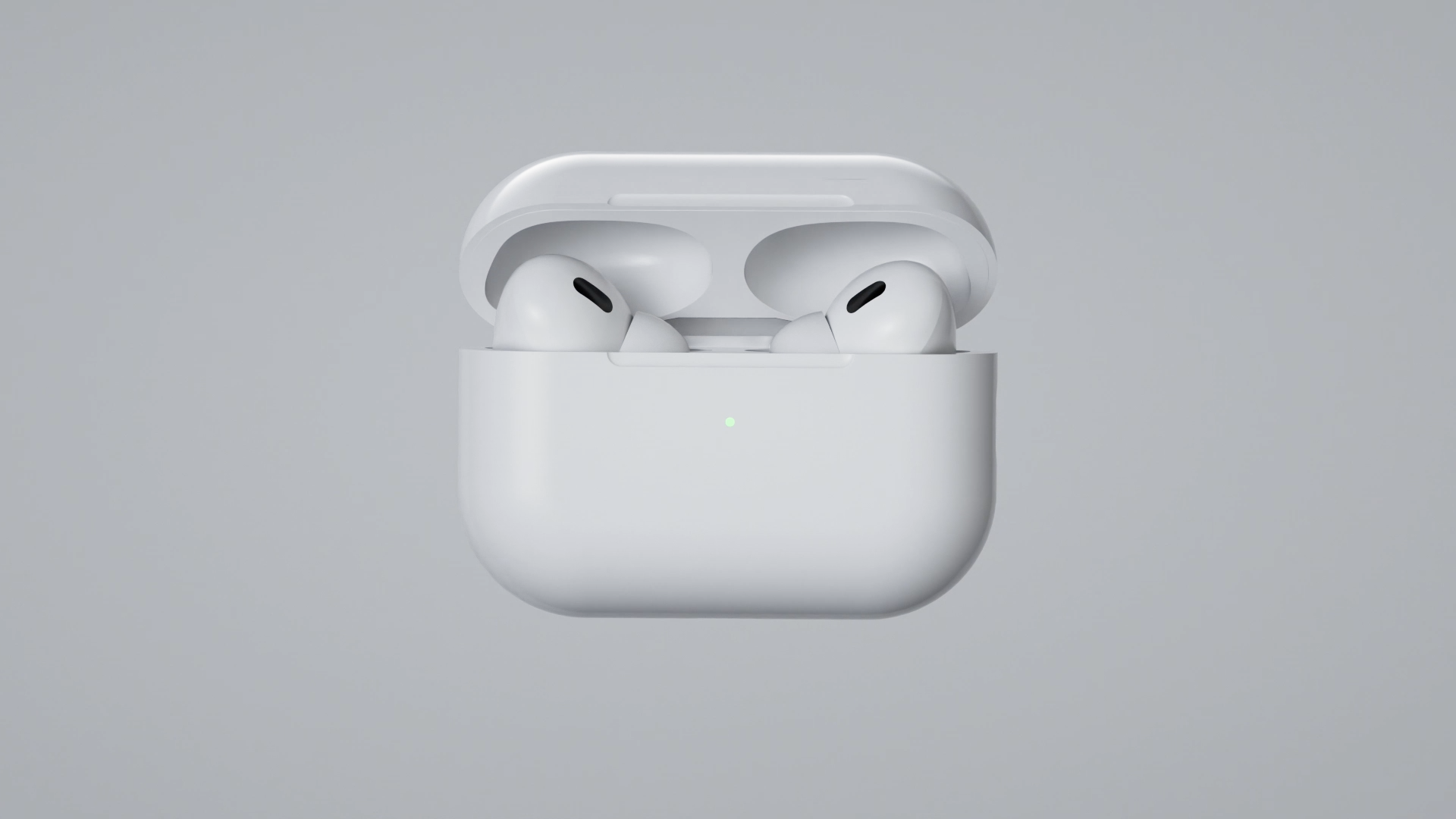 White wireless earbuds resting in an open charging case with a sleek design, featuring a small LED indicator light, against a light grey background.