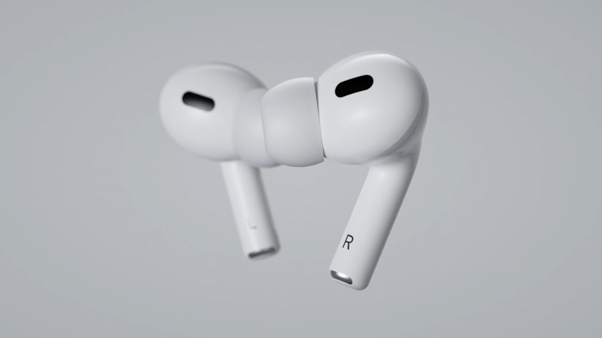Close-up of white in-ear wireless earbuds with sleek design, floating against a light grey background