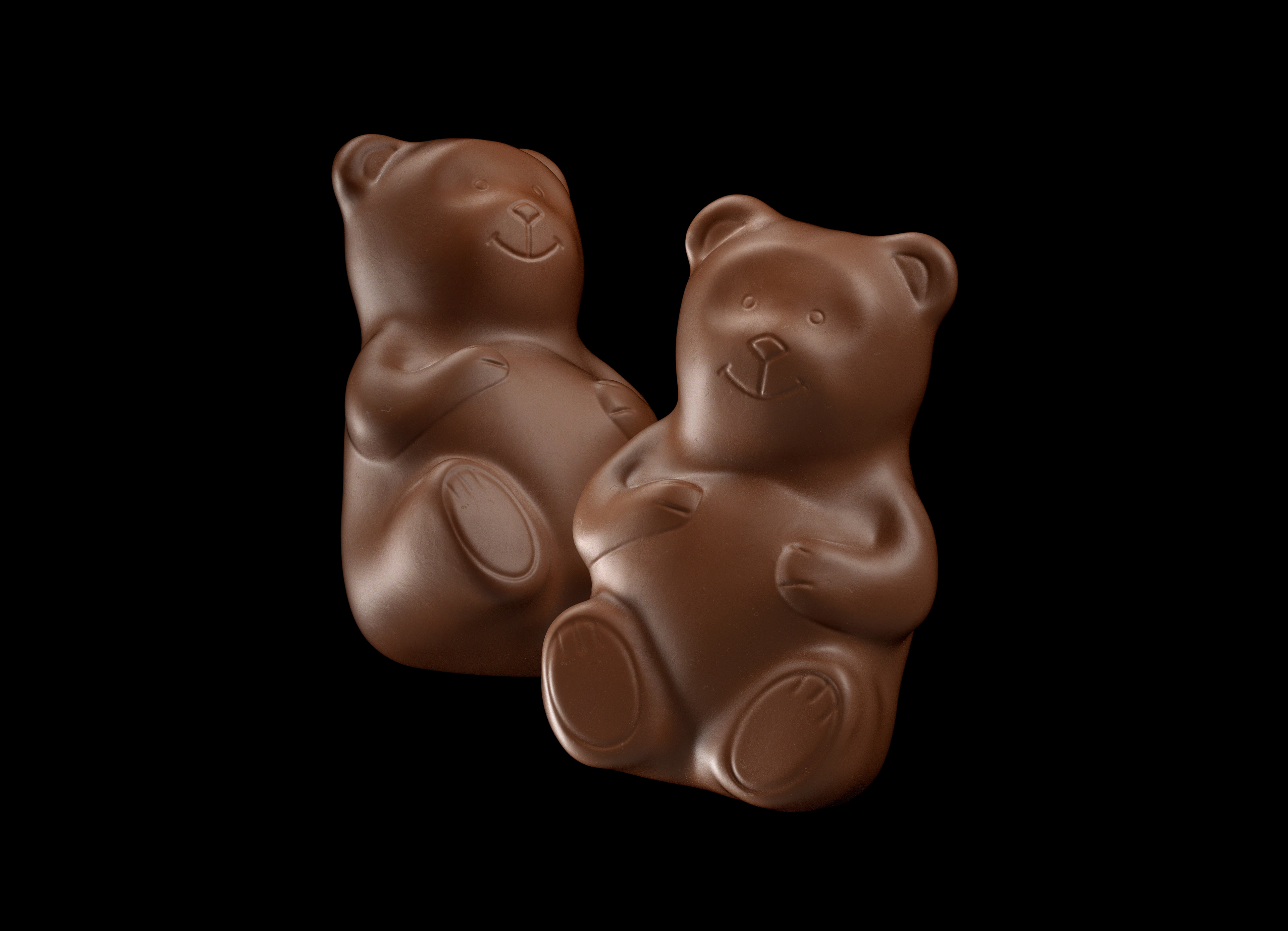 Two chocolate bear figurines with smooth and detailed design, placed against a black background.