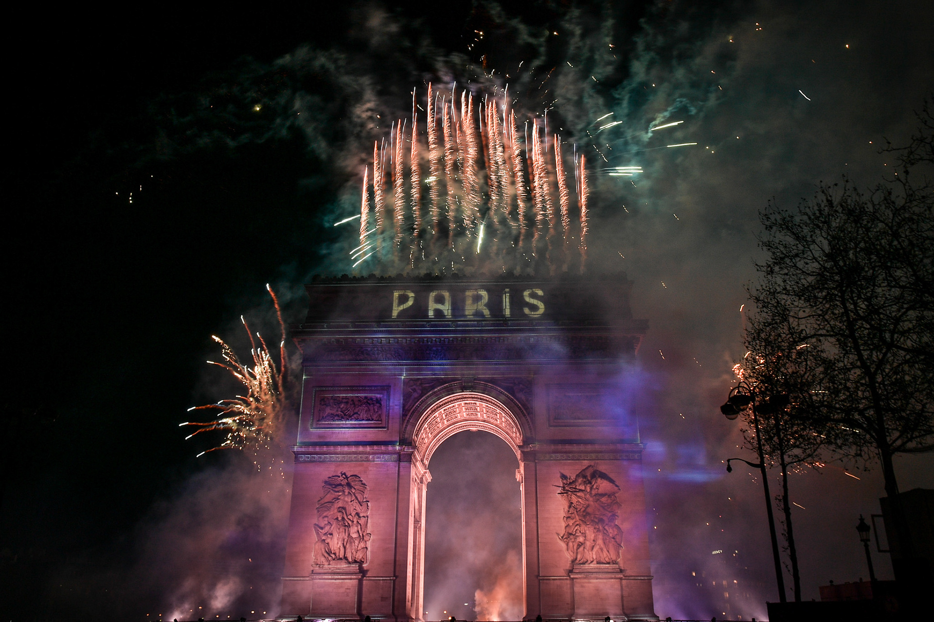 Fireworks of the New Year's celebration at the Arc de Triomphe at the top of the Champs-Elysees in Paris, on January 1, 2024. Firas Abdullah / Abaca Press