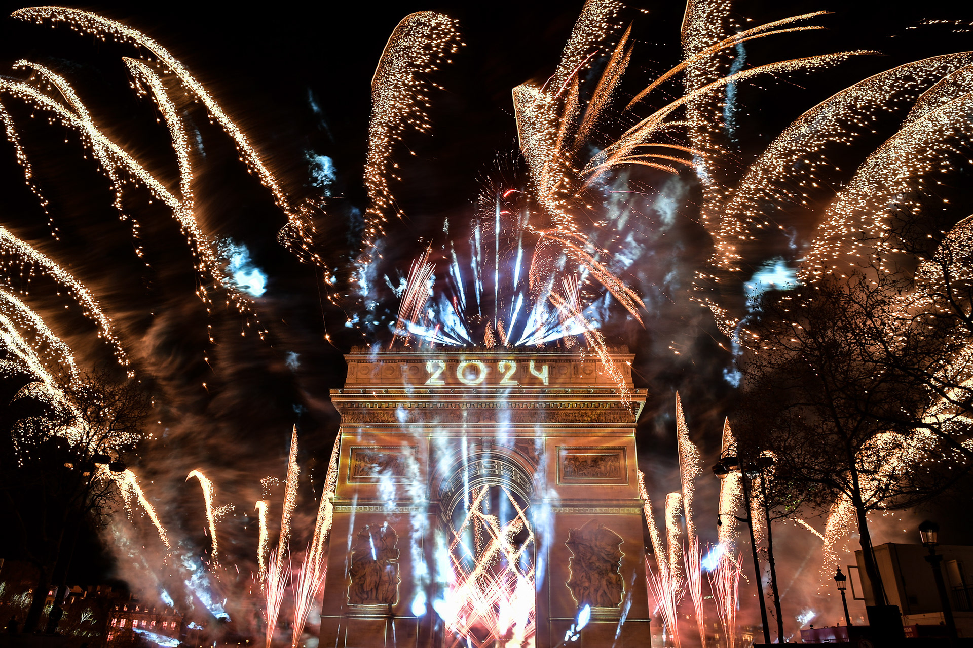 Fireworks of the New Year's celebration at the Arc de Triomphe at the top of the Champs-Elysees in Paris, on January 1, 2024. Firas Abdullah / Abaca Press