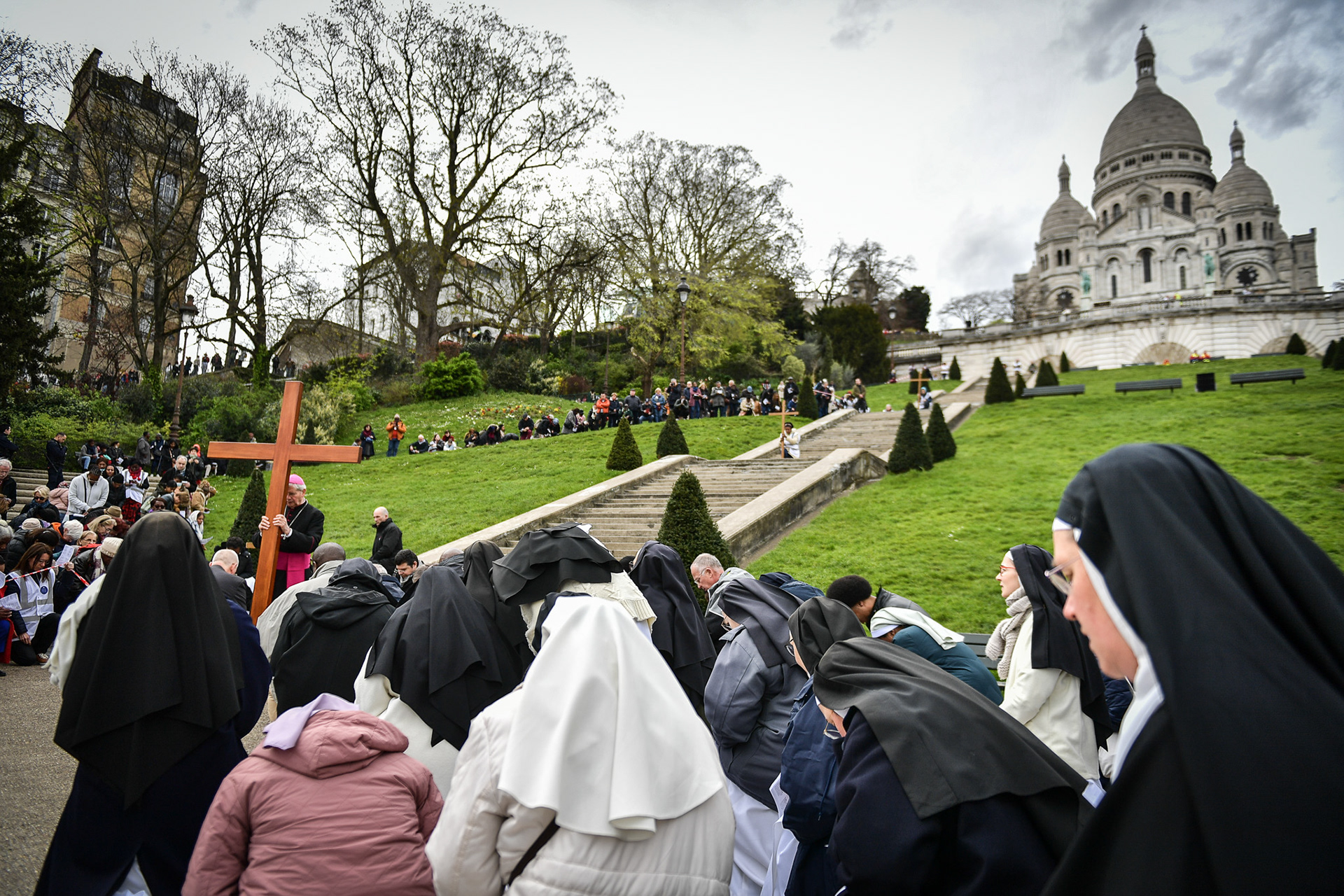 Nuns and worshippers attend the Stations of the Cross procession on Good Friday in front of Notre Dame de Paris Cathedral and Sacre Coeur Basilica in Paris on March 29, 2024. Firas Abdullah / Abaca Press