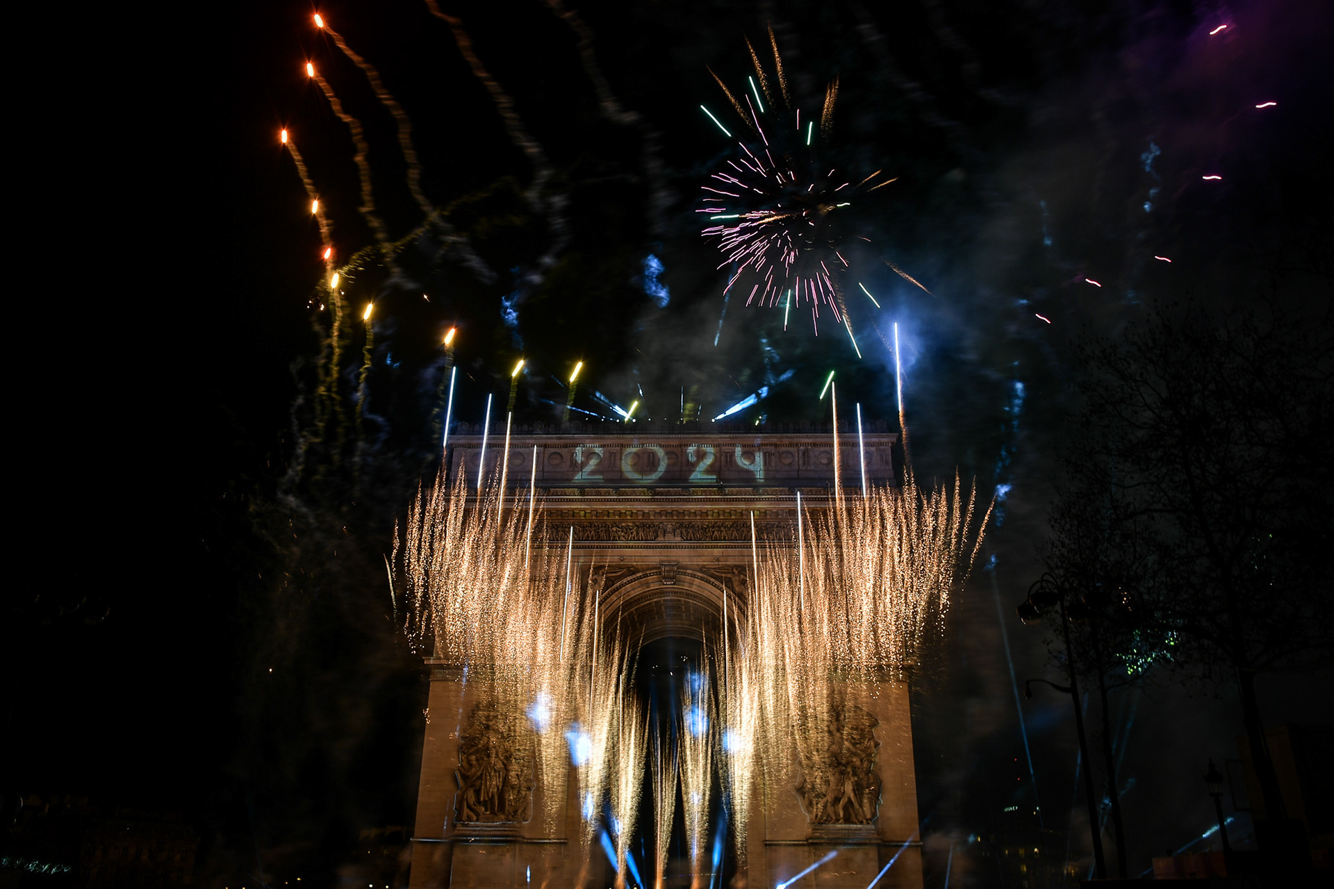 Fireworks of the New Year's celebration at the Arc de Triomphe at the top of the Champs-Elysees in Paris, on January 1, 2024. Firas Abdullah / Abaca Press