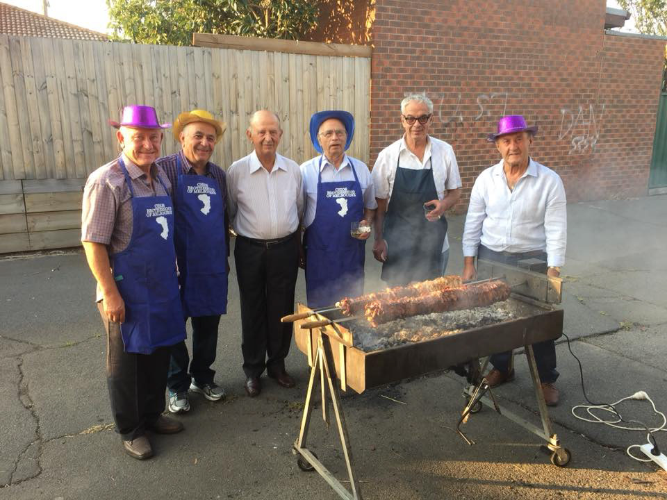 Chios Brotherhood of Melbourne's Kitchen Team in Action: Expertly Preparing Gyros for Carnival in Their Custom-Designed Aprons