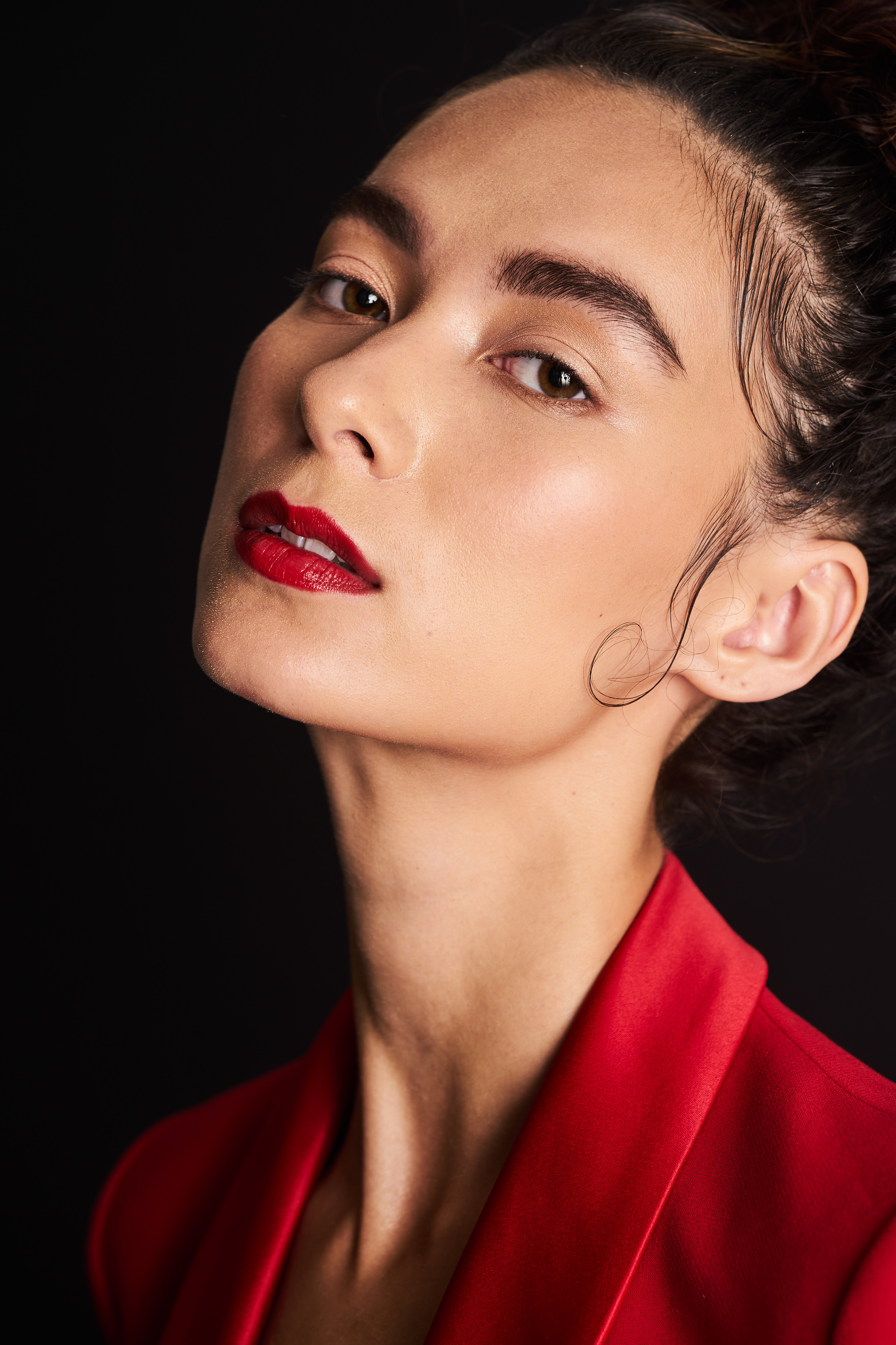 Fashion Model Suzannah Yumi shot with JMstudio in Amsterdam, sporting an up-do, a red suit, and red lips. 