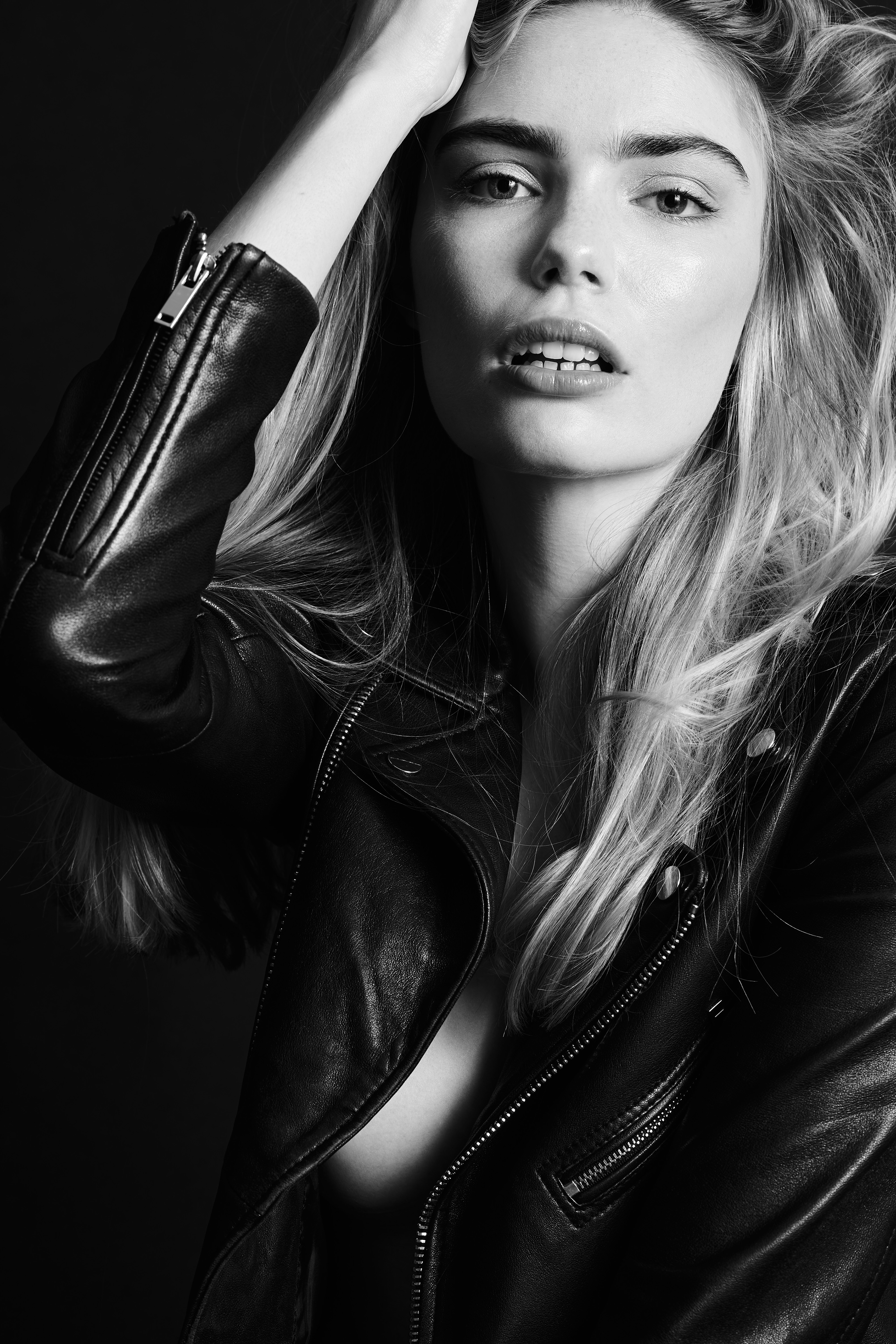 Miss Netherlands Finalist Marlies Smedinga in some black and white shots wearing a leather jacket.