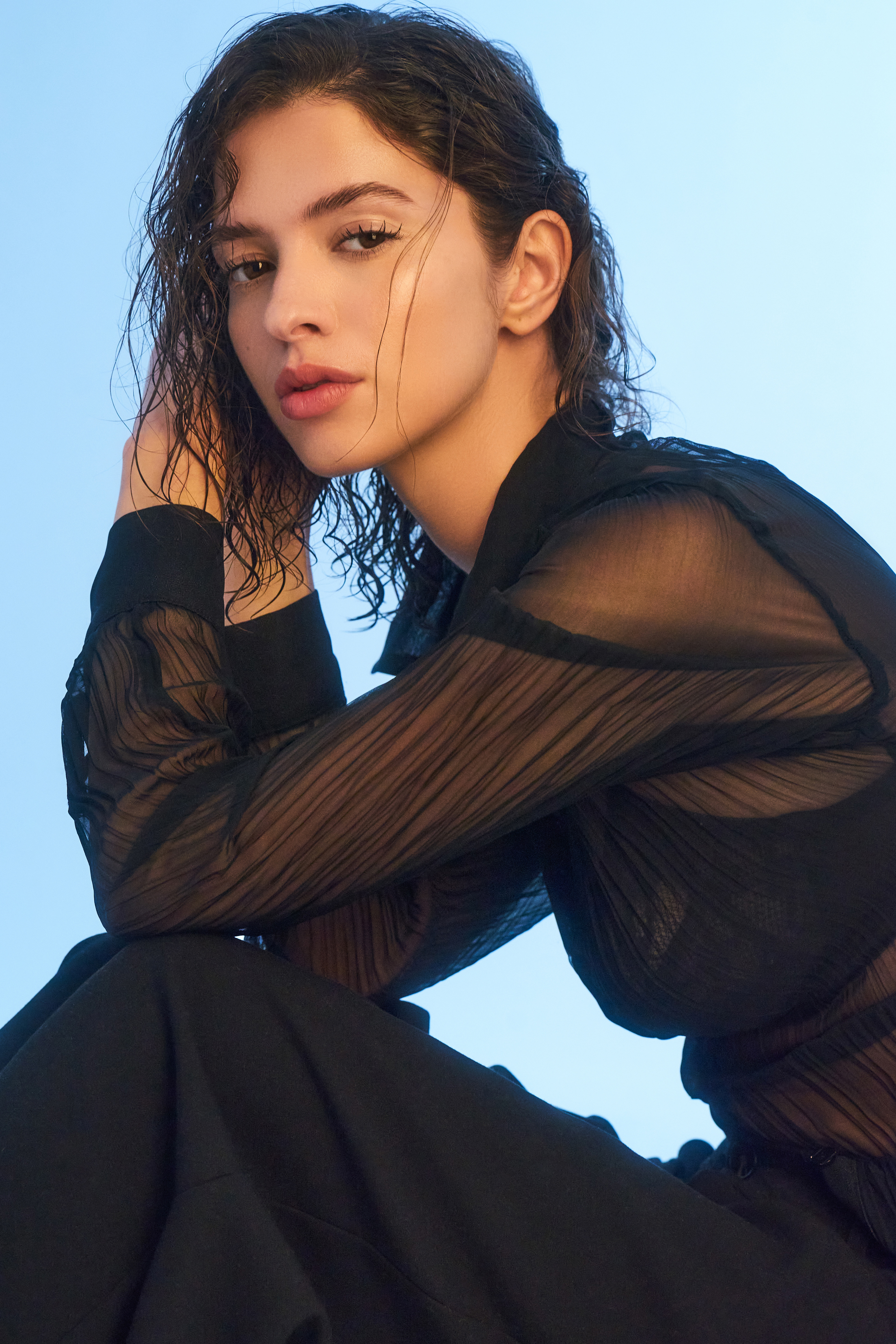 Yasmina shot in lace with a blue background