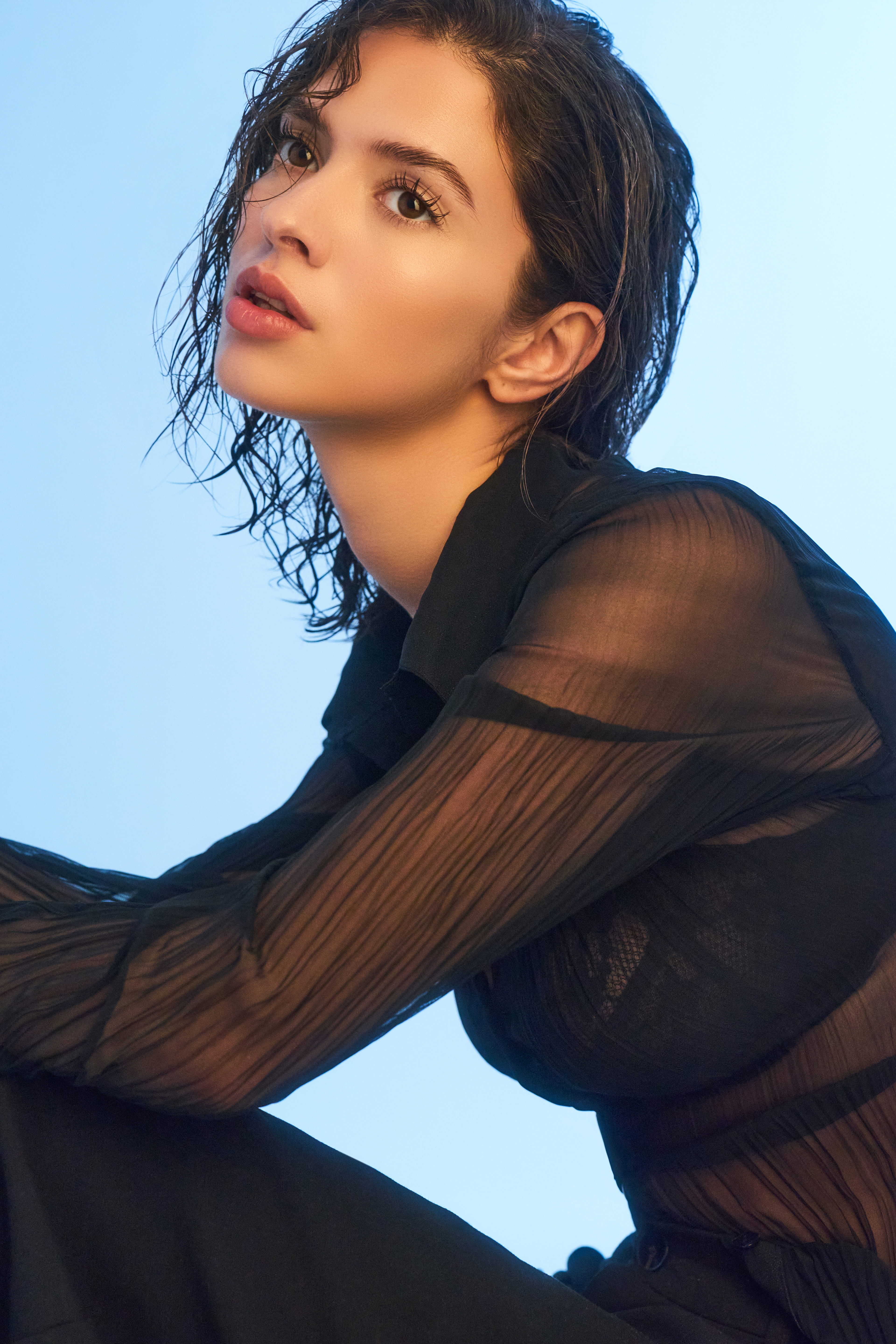 Yasmina shot in lace with a blue background