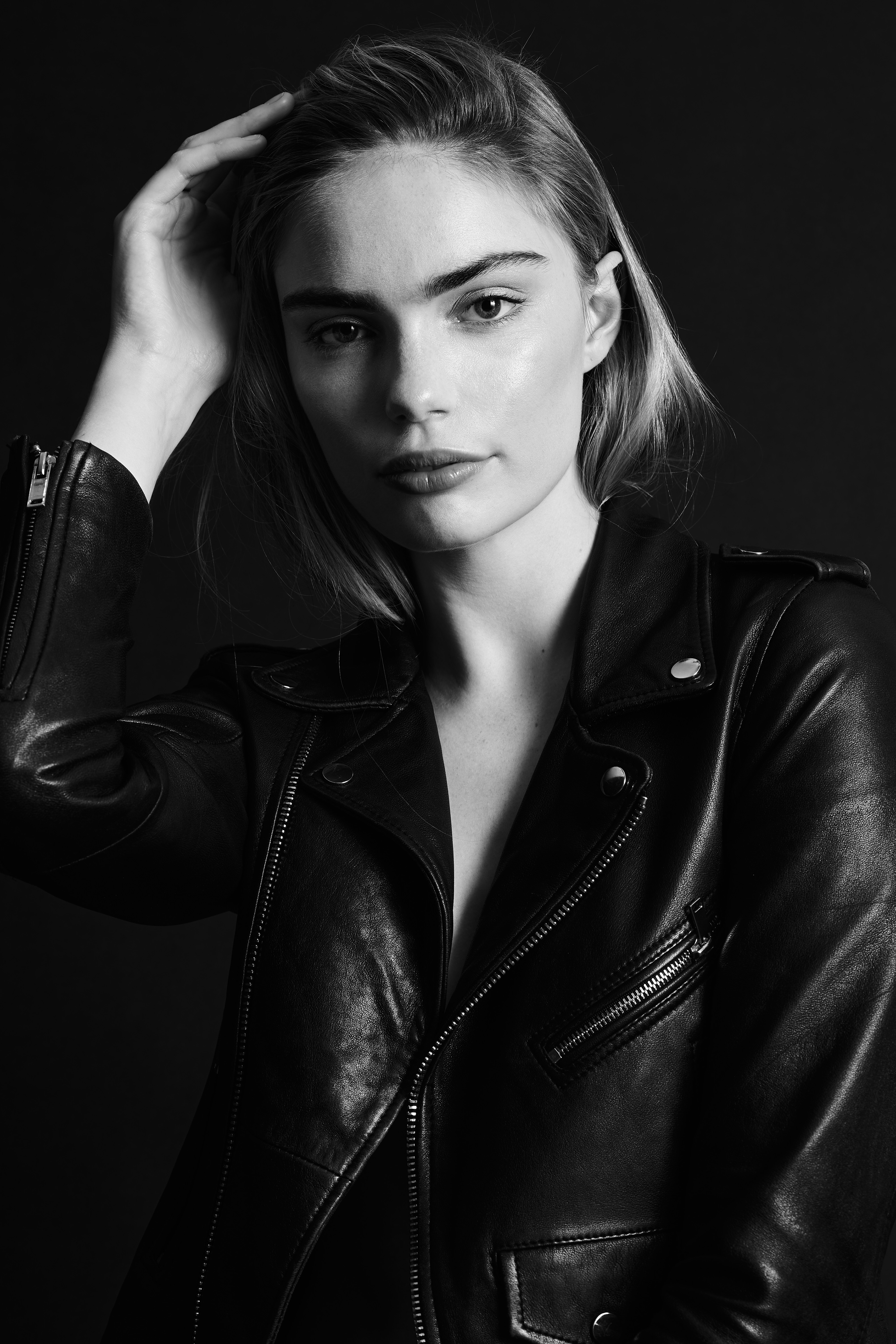 Miss Netherlands Finalist Marlies Smedinga in some black and white shots wearing a leather jacket.