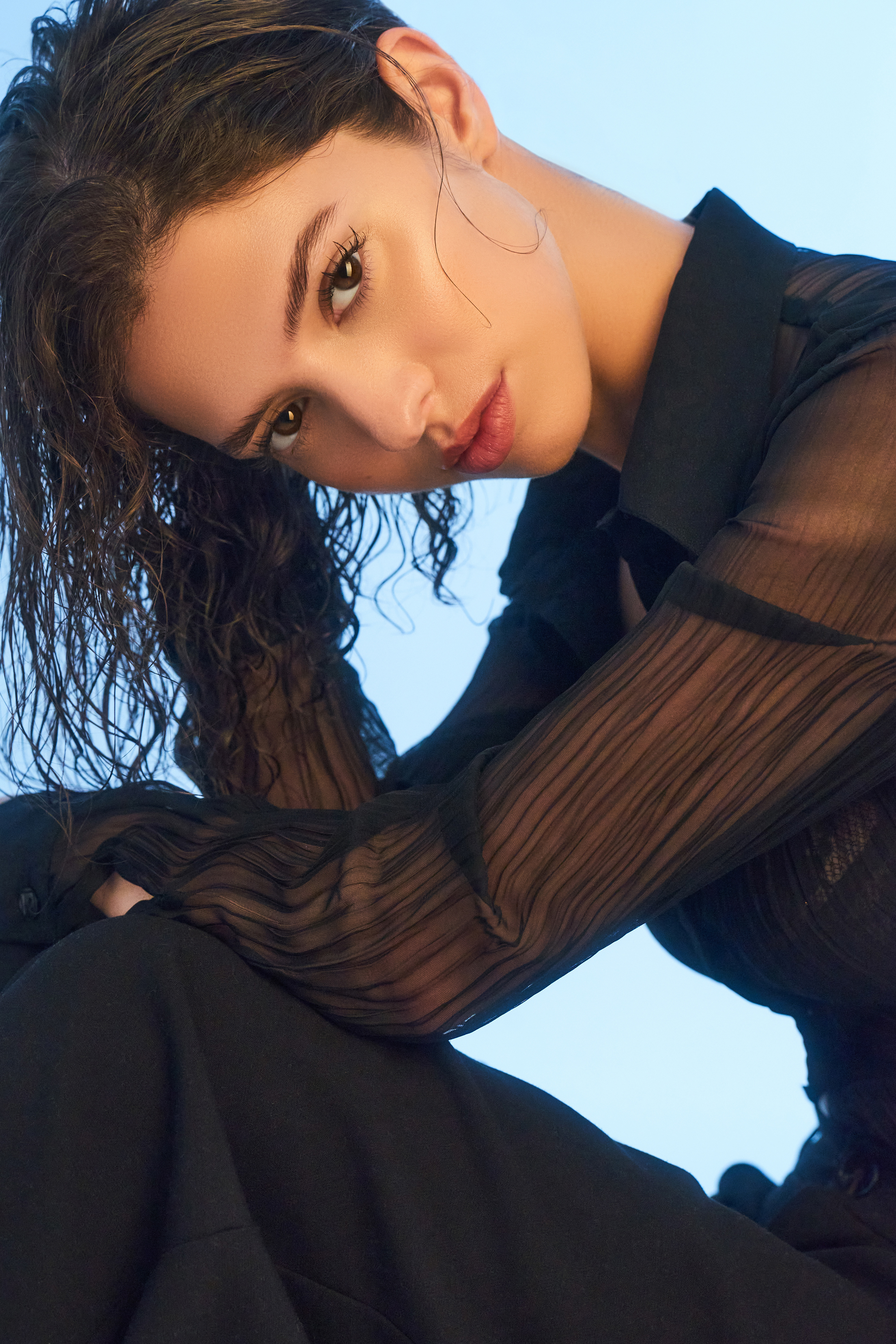 Yasmina shot in lace with a blue background