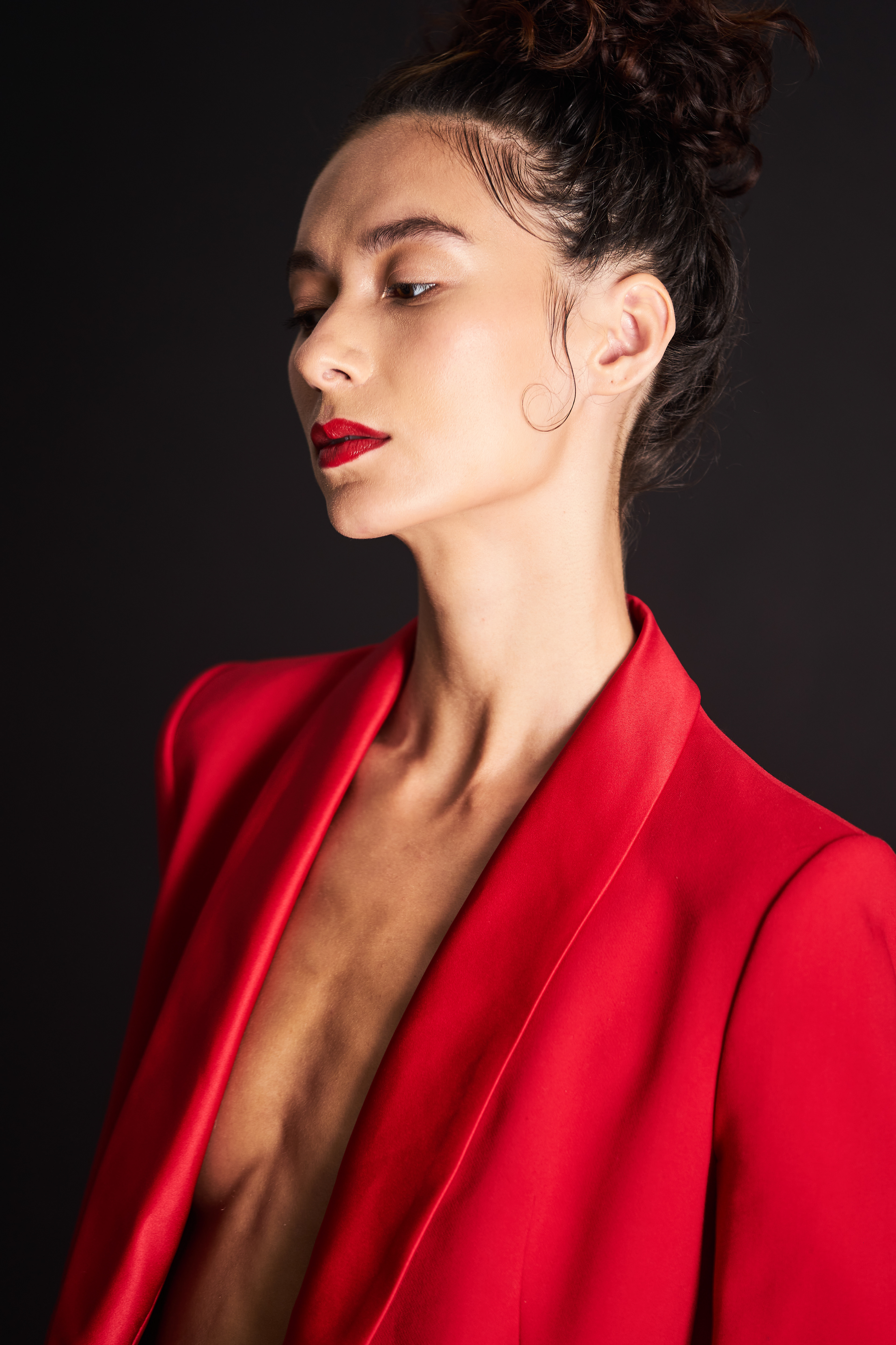 Fashion Model Suzannah Yumi shot with JMstudio in Amsterdam, sporting an up-do, a red suit, and red lips. 