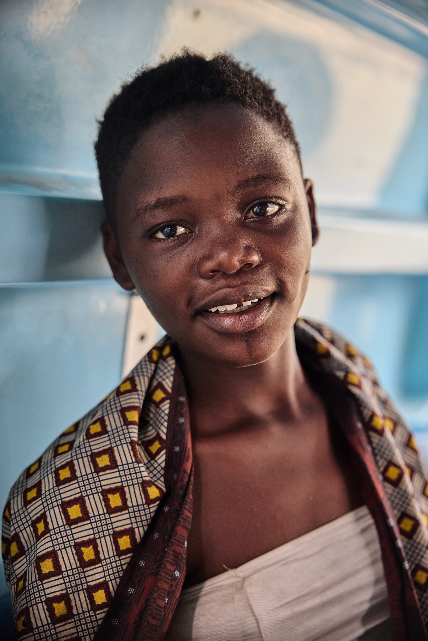 Portrait of a smiling young person in Kinshasa, DR Congo, from the documentary Healing Kinshasa