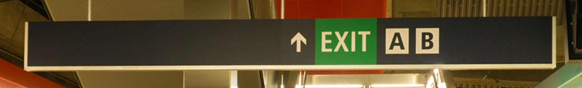 Existing exit directional sign.