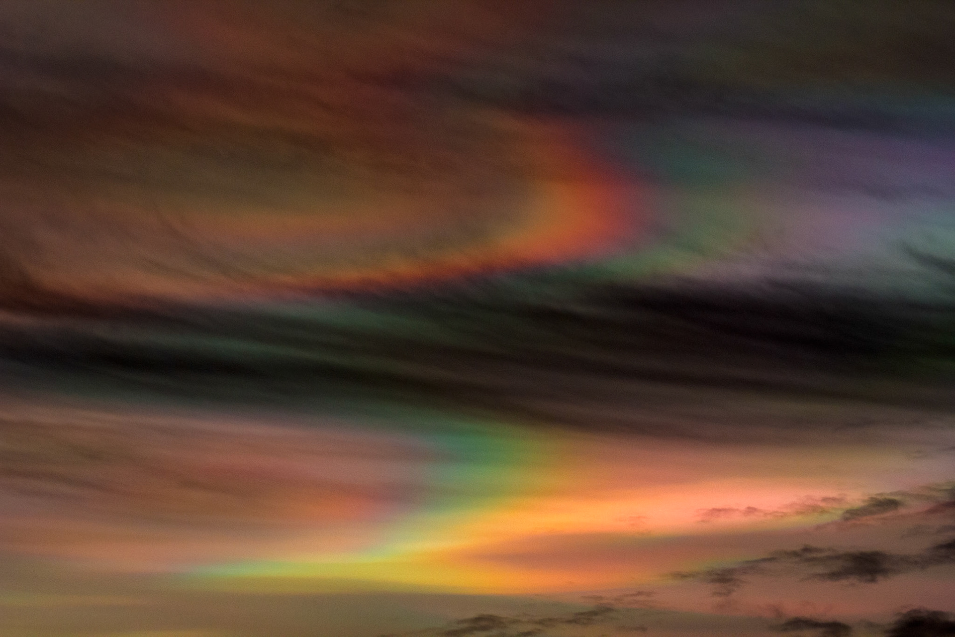 Livingston, West Lothian - Nacreous clouds (Mother-of-pearl cloud) at sunset - viewed from Livingston, West Lothian. There's some grey clouds in front for dramatic effect, plus a bit of post sunset glow.