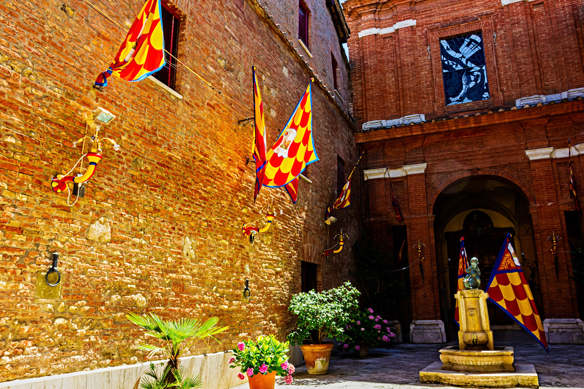Street scene in Siena with Palio decorations - 26 June 2024