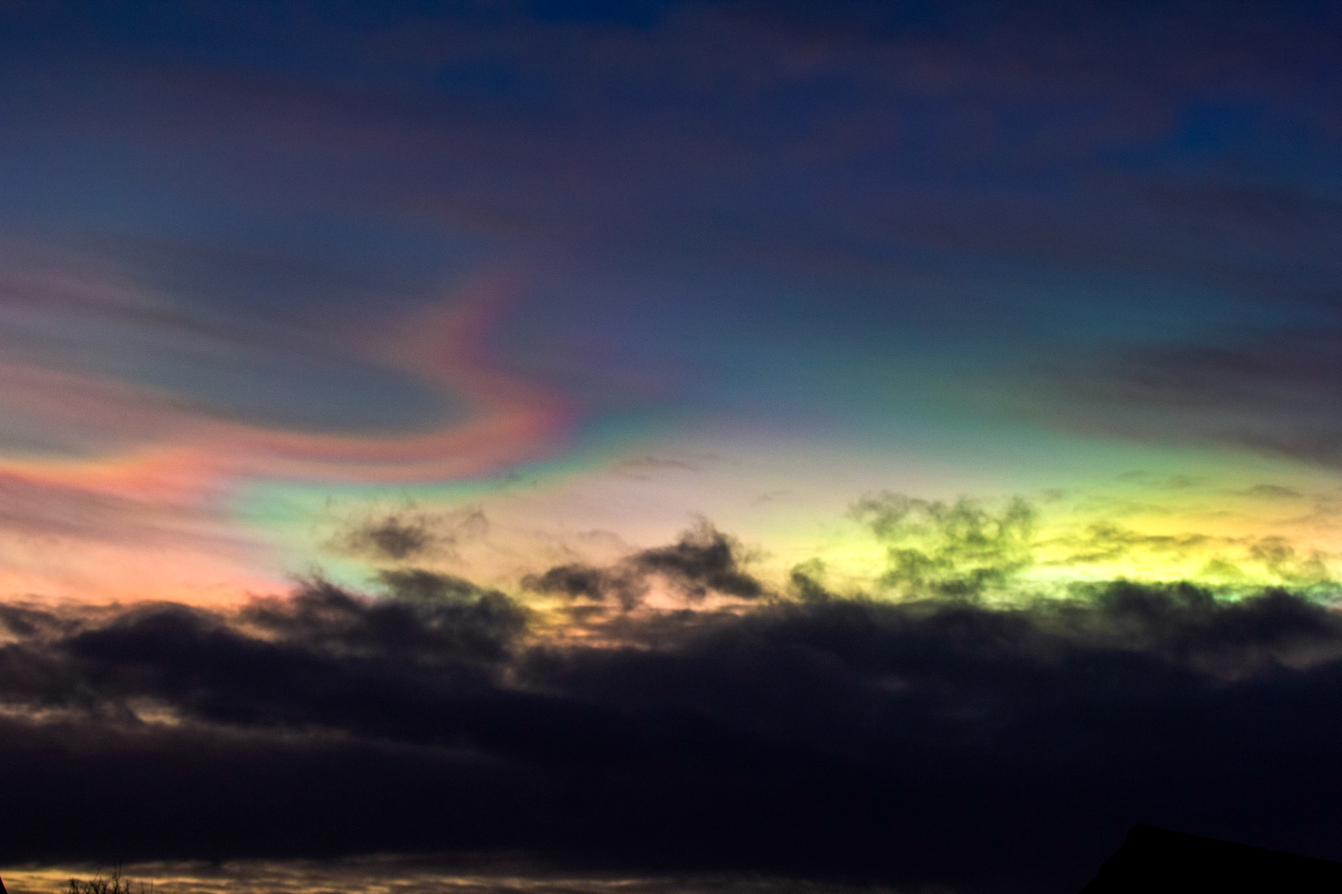 Livingston, West Lothian - Nacreous clouds (Mother-of-pearl cloud) at sunset - viewed from Livingston, West Lothian. There's some grey clouds in front for dramatic effect, plus a bit of post sunset glow.