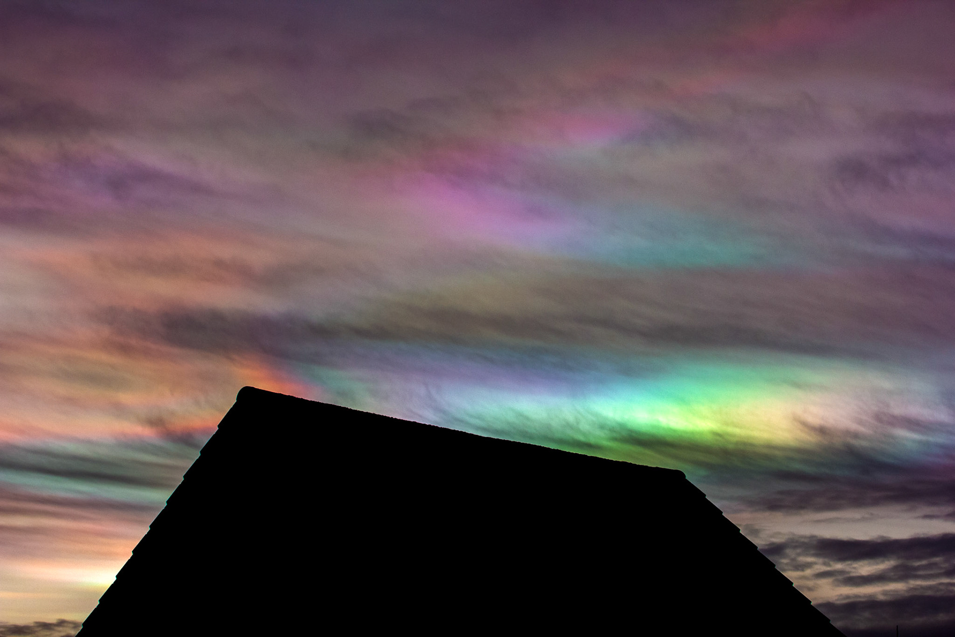 Livingston, West Lothian - Nacreous clouds (Mother-of-pearl cloud) at sunset - viewed from Livingston, West Lothian. There's some grey clouds in front for dramatic effect, plus a bit of post sunset glow.