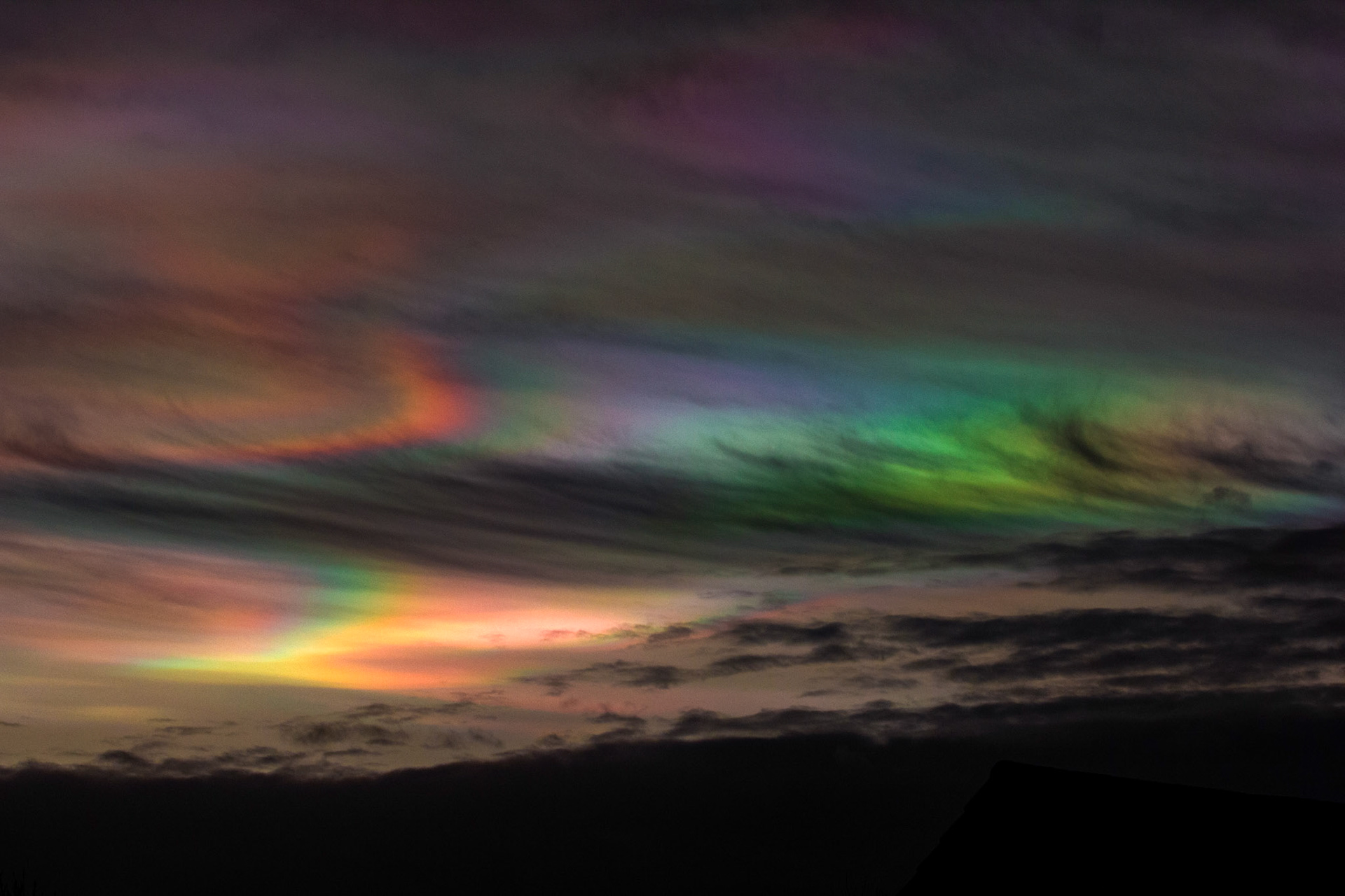 Livingston, West Lothian - Nacreous clouds (Mother-of-pearl cloud) at sunset - viewed from Livingston, West Lothian. There's some grey clouds in front for dramatic effect, plus a bit of post sunset glow.