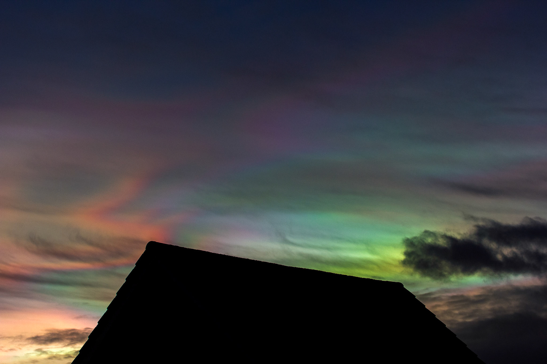 Livingston, West Lothian - Nacreous clouds (Mother-of-pearl cloud) at sunset - viewed from Livingston, West Lothian. There's some grey clouds in front for dramatic effect, plus a bit of post sunset glow.