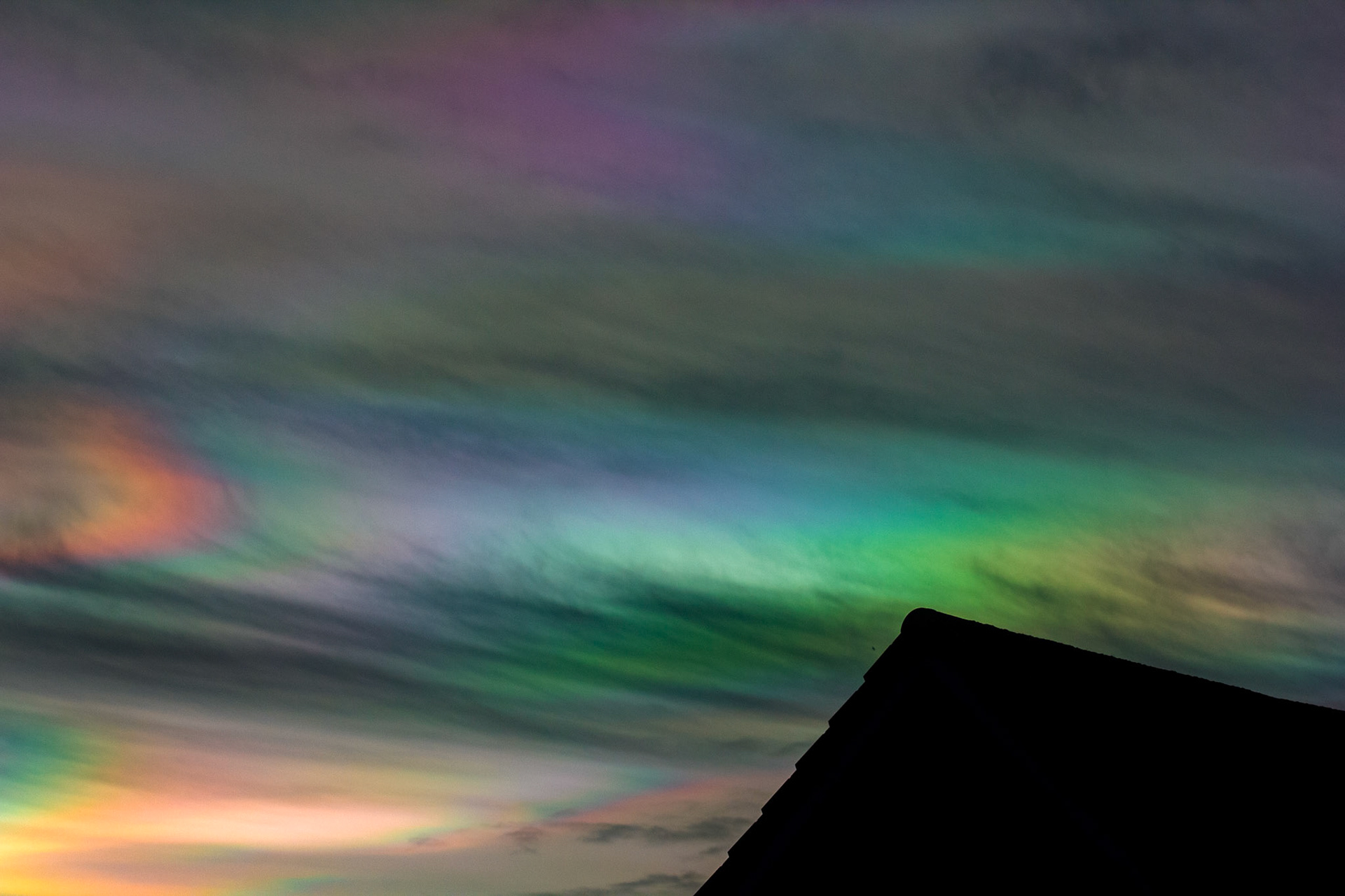Livingston, West Lothian - Nacreous clouds (Mother-of-pearl cloud) at sunset - viewed from Livingston, West Lothian. There's some grey clouds in front for dramatic effect, plus a bit of post sunset glow.
