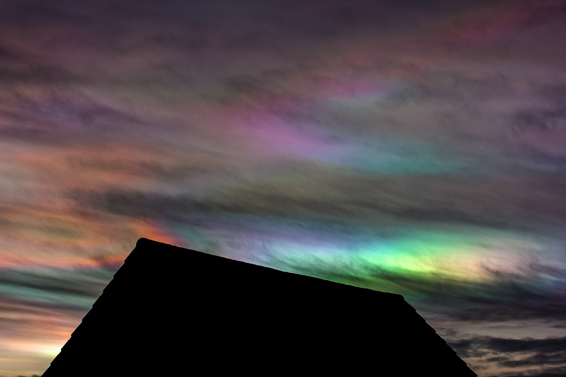 Livingston, West Lothian - Nacreous clouds (Mother-of-pearl cloud) at sunset - viewed from Livingston, West Lothian. There's some grey clouds in front for dramatic effect, plus a bit of post sunset glow.