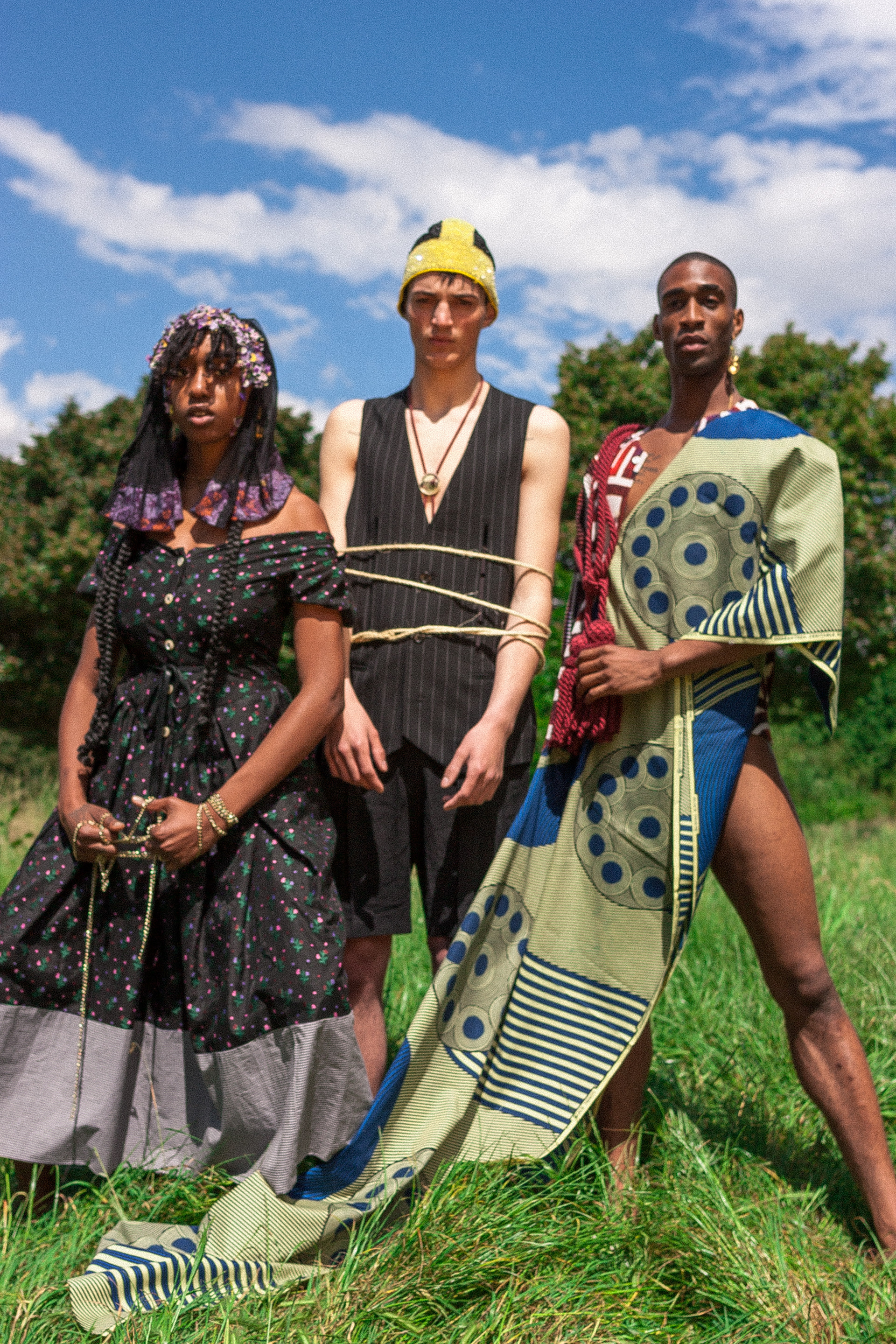 From Left to Right Vivienne Westwood dress, Headpiece Bora Aksu, Chalayan Suits, Issey Miyake Shirt