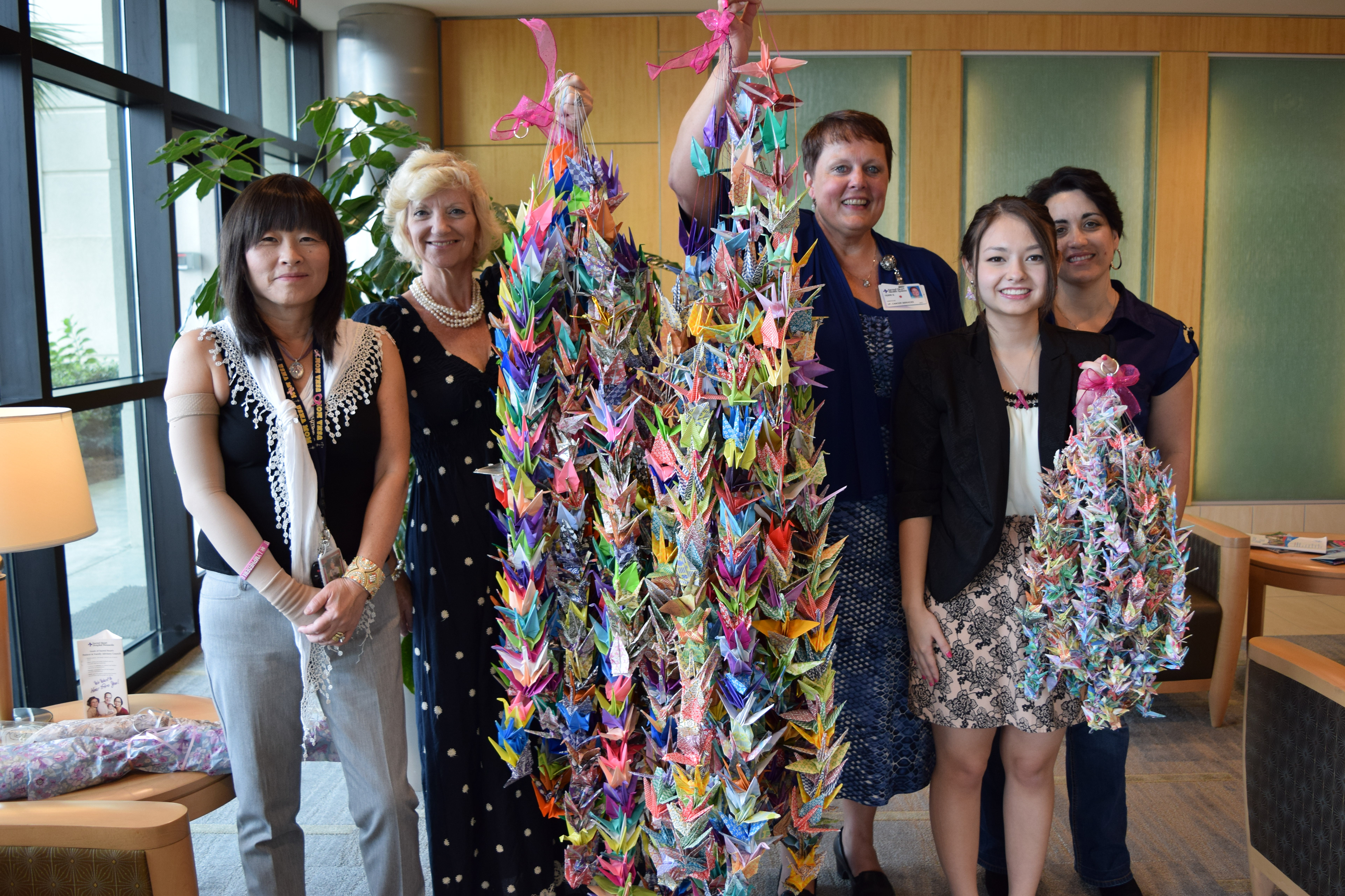 Isabella Dinelli founder of wings of cancer poses with staff from hospital