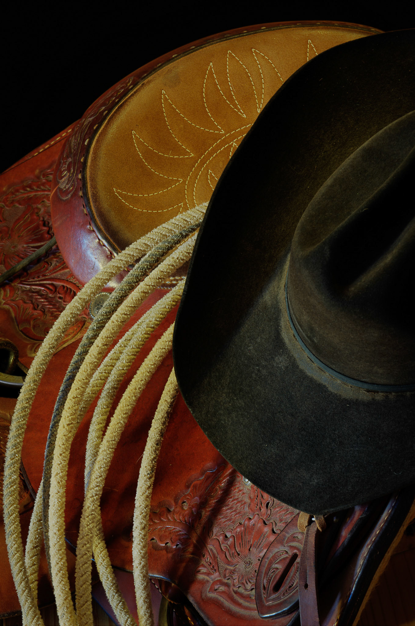 Dusty Hat Rope and Saddle