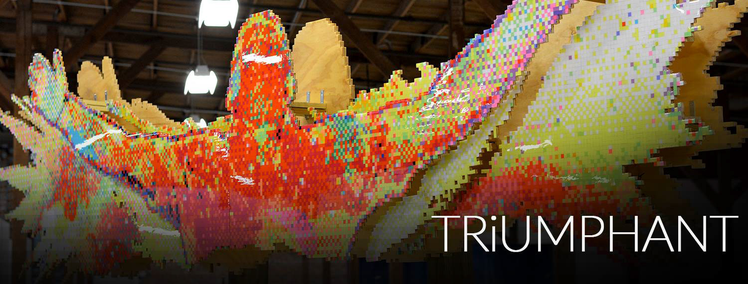TRiUMPHANT - There are times in life when you have to be real. When holding back won’t cut it. I poured my heart into the creation of this artwork which shows my victory through pain. Never let circumstances control you. Be TRiUMPHANT.  About The Artwork:  TRiUMPHANT was created over the course of 7 months and has over 18,000 hand punched and individually glued squares of various colored card stock paper to form one image. It was nearly 15 1/2 ft long and stands around 9ft tall. 