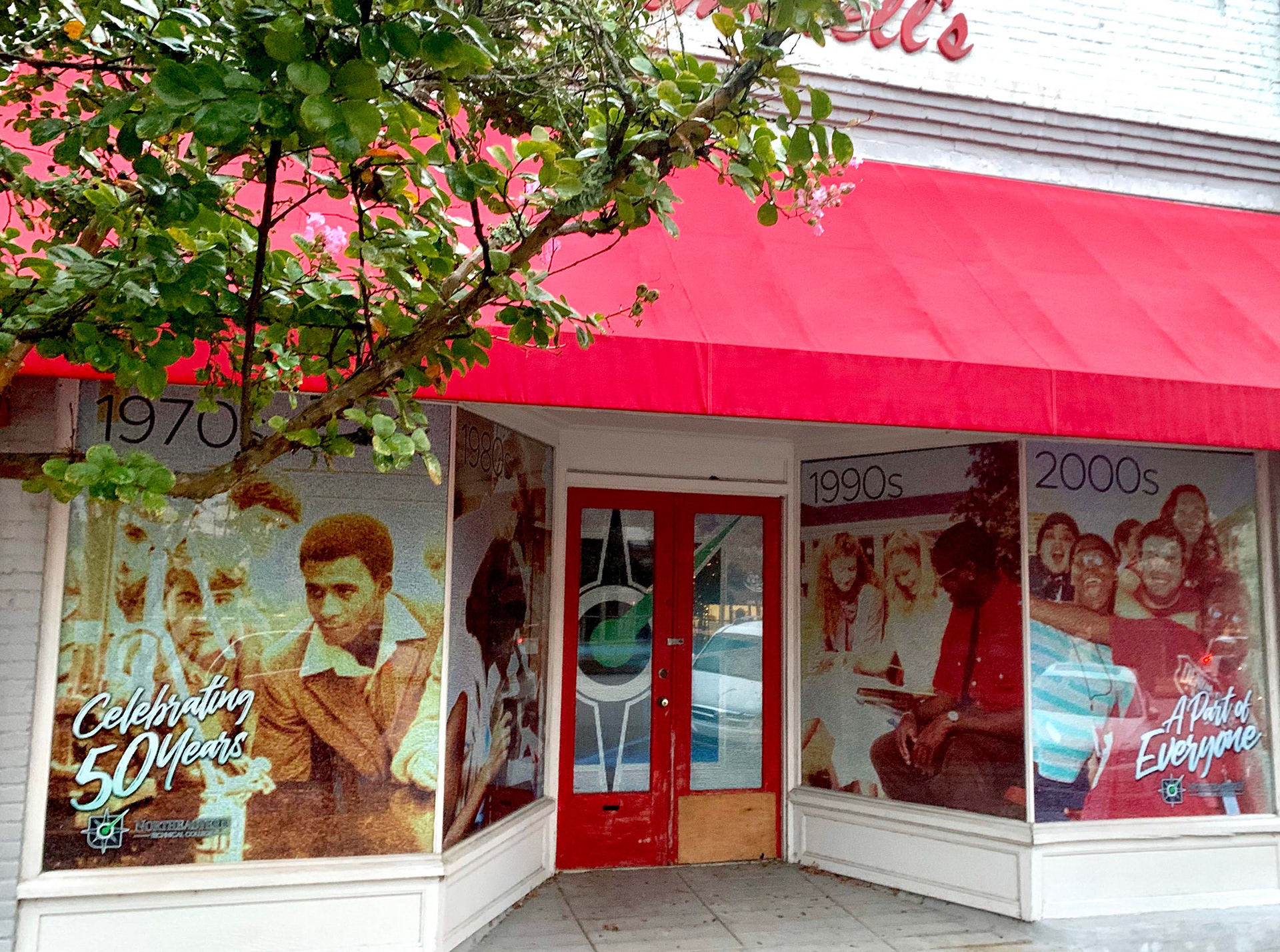 NETC 50th Anniversary - This large-scale storefront installation brought Northeastern Technical College’s history into the community through a decade-by-decade visual timeline. Each window panel is part of a massive photo mosaic built from nearly 9,000 images spanning NETC’s history, arranged across 160,000 placeholders. Prominently featured in the foreground is the phrase “A Part of Everyone,” representing NETC’s deep connection to the local community. I was given the time and creative freedom to design and carefully collect, review, and curate thousands of photos across multiple decades, allowing the final piece to authentically reflect the people and moments that shaped the college.   This project earned a 2020 NCMPR Medallion Award for Northeastern Technical College.