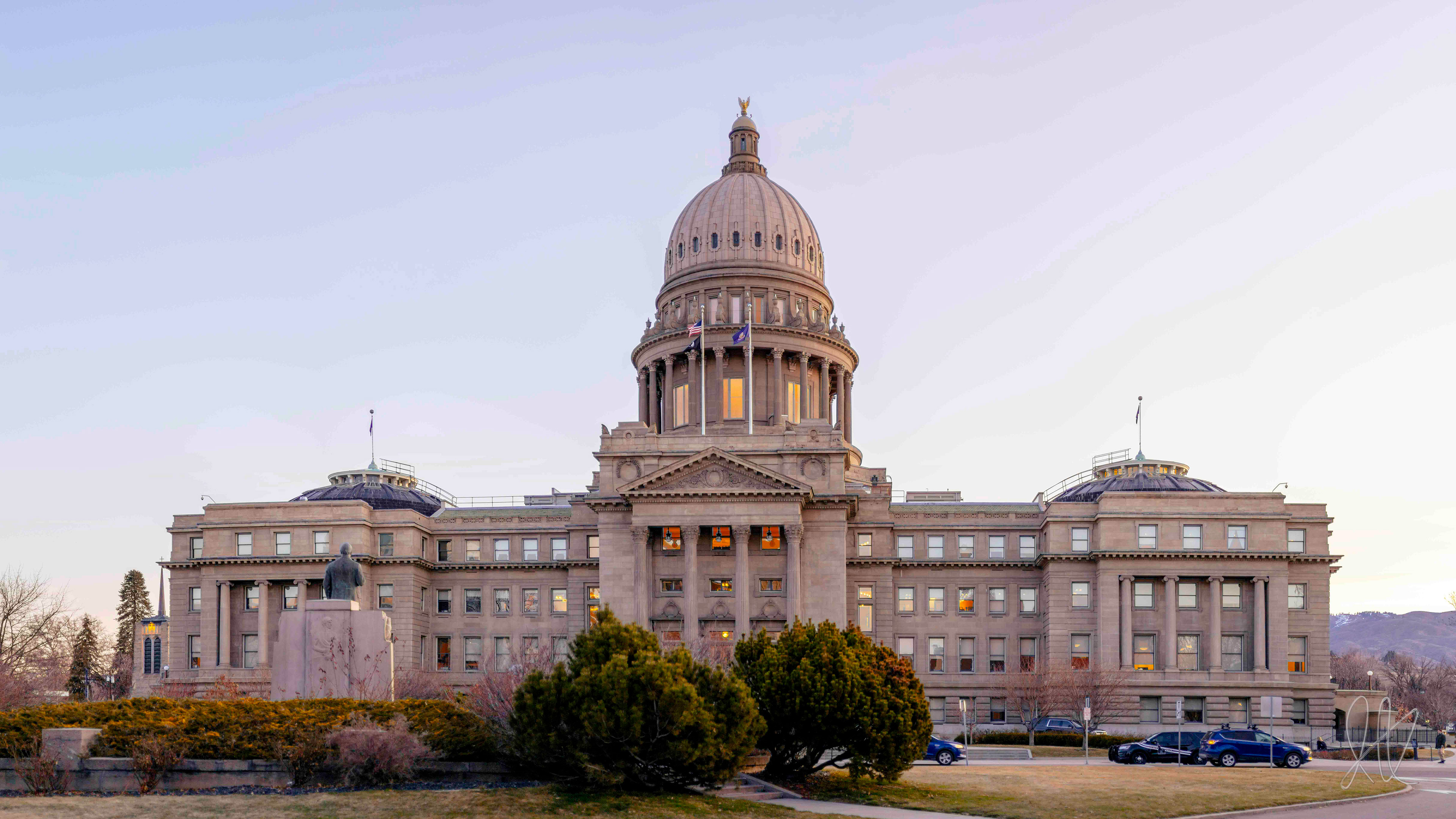 The Idaho State Capitol stands under a bright sky