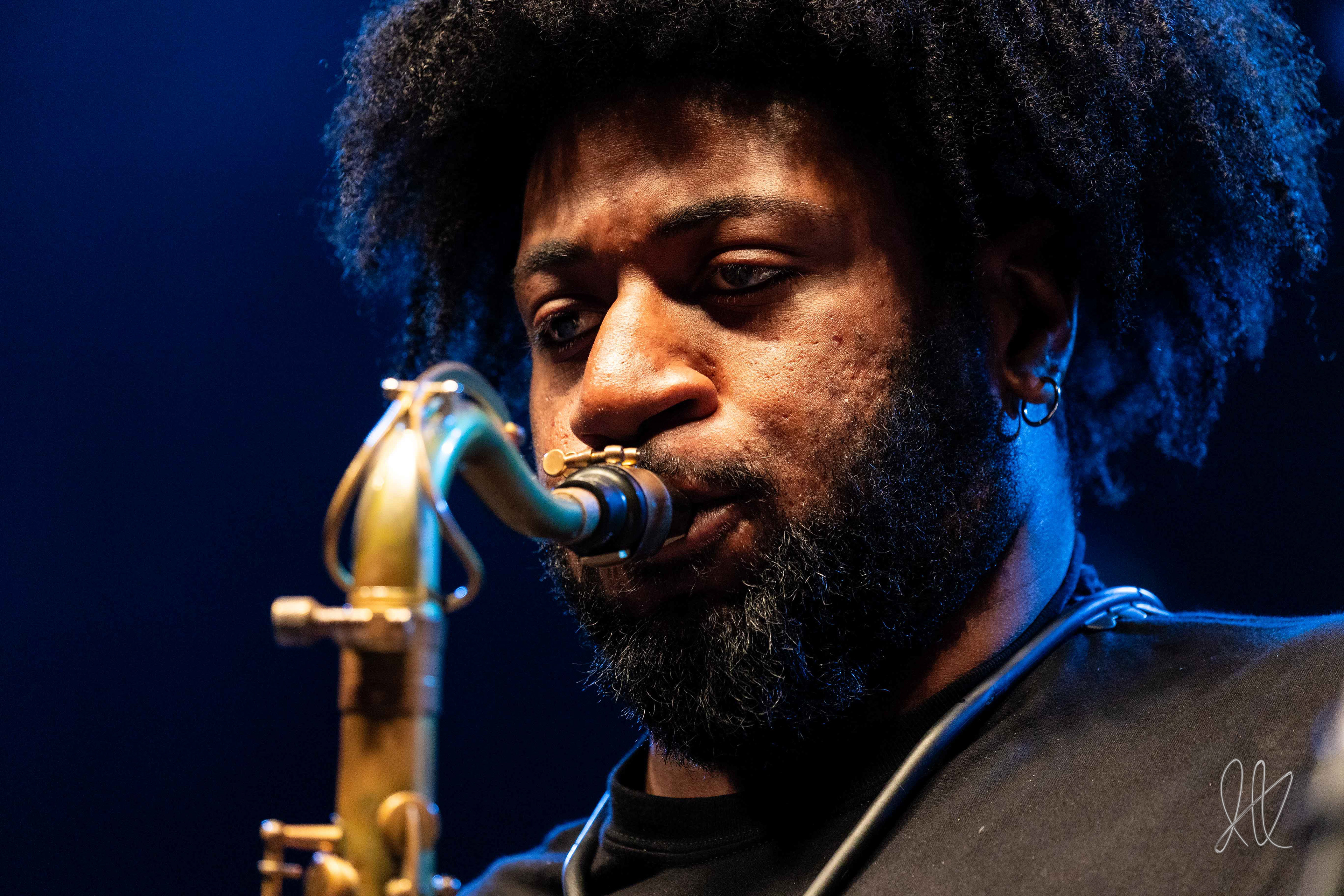 Hamp’s Jazz Ambassadors’ Caleb Robinson performs a somber tenor saxophone solo