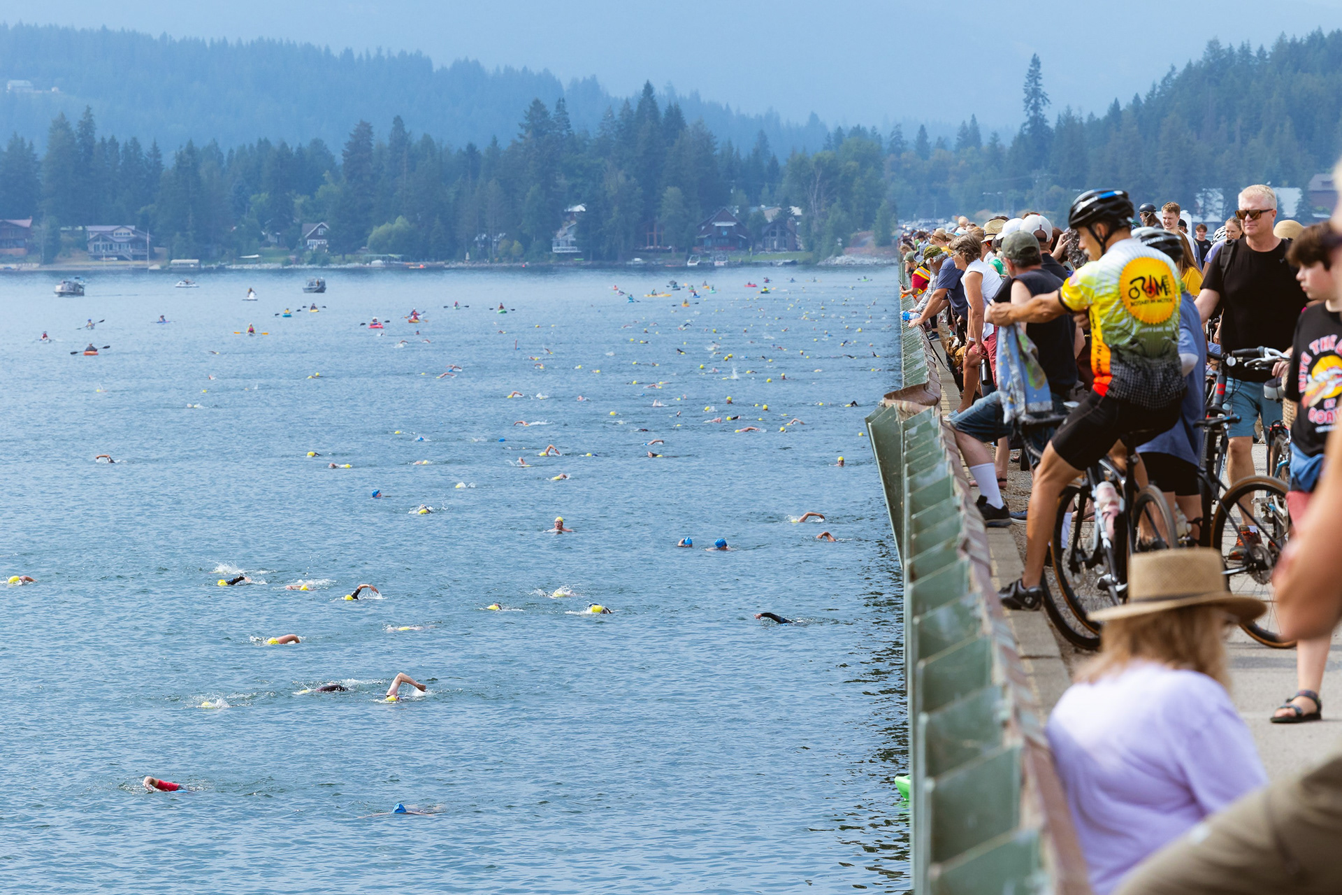 Racers in Sandpoint, Idaho’s annual Long Bridge Swim event make their way across the 1.76-mile wide river, as spectators watch from the Long Bridge, August 3, 2024. (Photo/John Keegan)