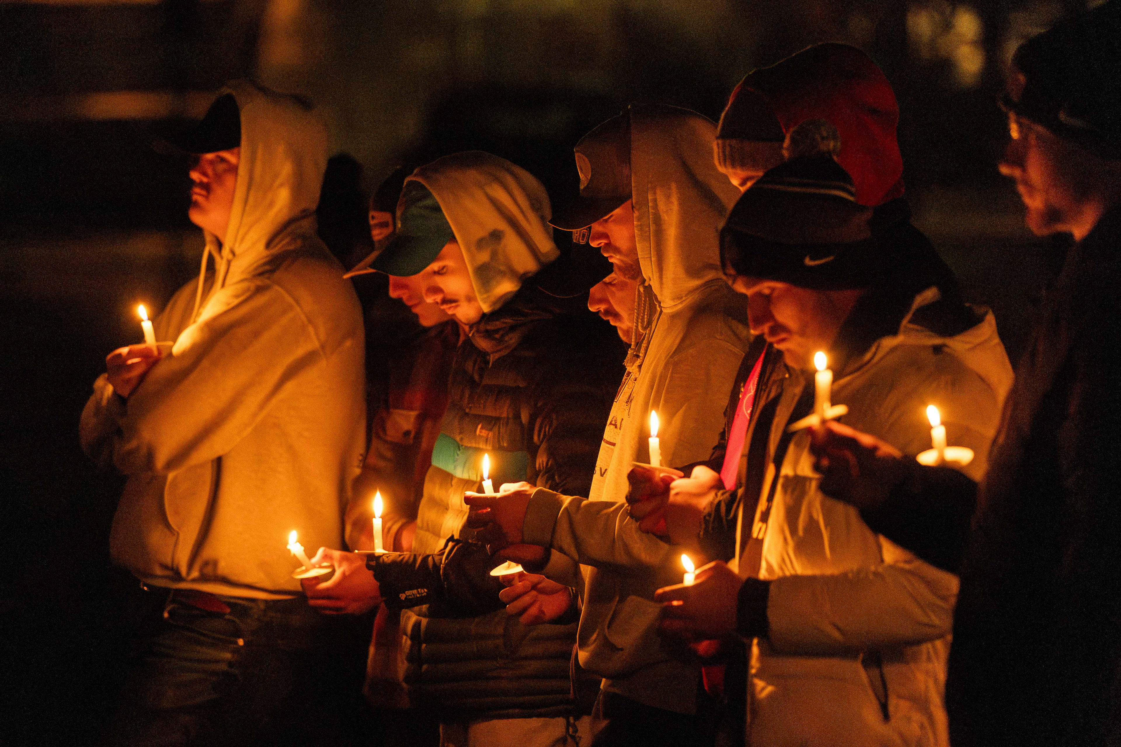 A group of vigil attendees bow their heads in a moment of silence. The vigil held on Nov. 13, 2024, marked the one-year anniversary of the murder of four University of Idaho students. (Argonaut/John Keegan)
