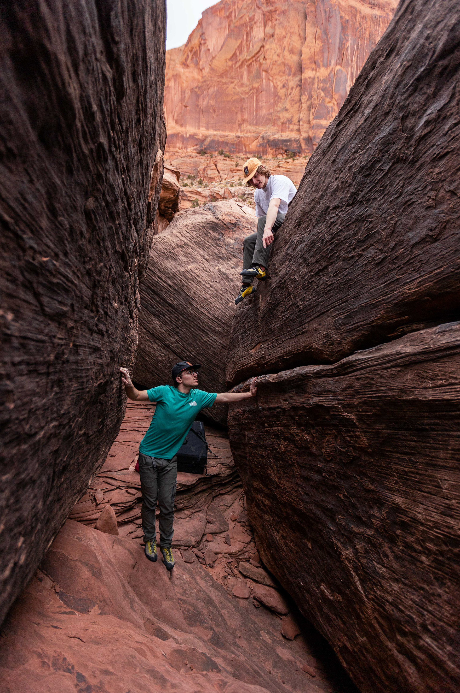 Peter Voller (lower) and Ian Kolaja scout bouldering routes at the popular “Labyrinth” climbing location outside of Moab, Utah. It is named such because of the numerous boulders that have narrow paths running between them. March 12, 2024. (Photo/John Keegan)