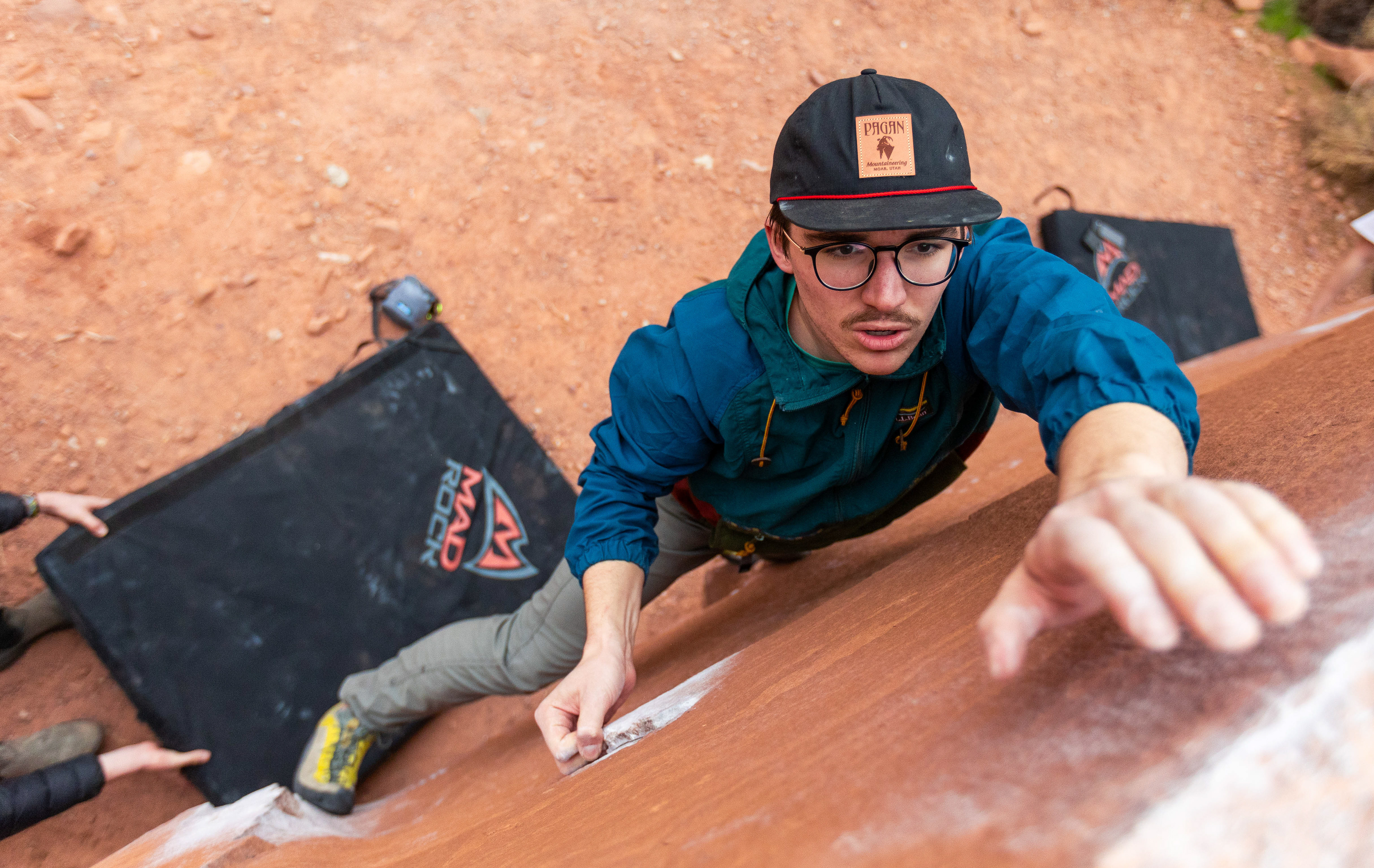 Peter Voller ascends a boulder in a valley south of Moab, Utah, March 12, 2024. (Photo/John Keegan)