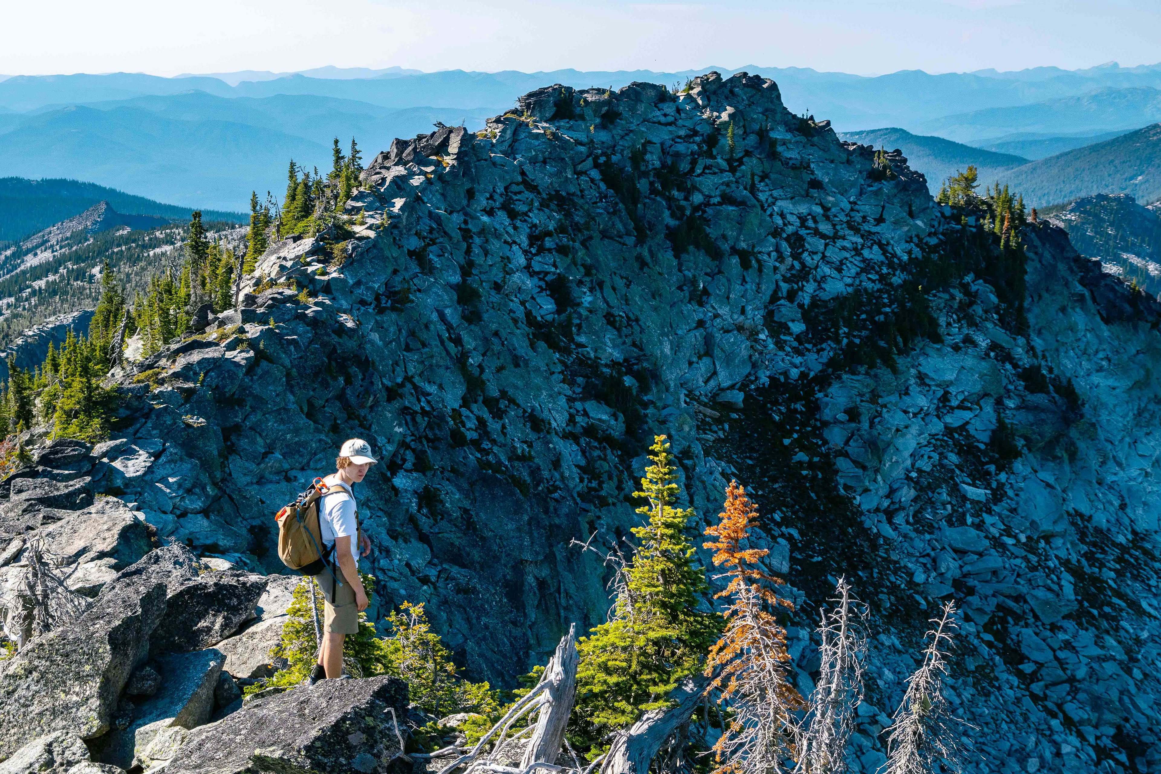 Ian Kolaja stands atop a highly exposed ridge as part of the “Selkirk Traverse” extended scramble in Bonner County, Idaho, Sept. 1, 2024. (Photo/John Keegan)