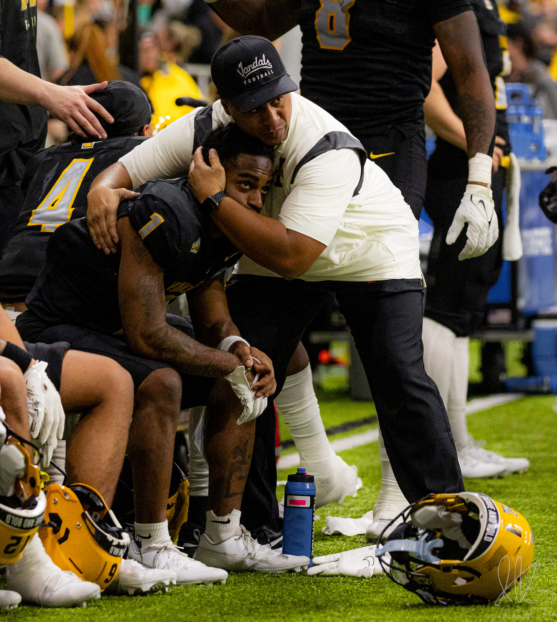 Special teams coordinator and future head coachThomas Ford embraces graduating Jermain Jackson as his last game closes to a loss