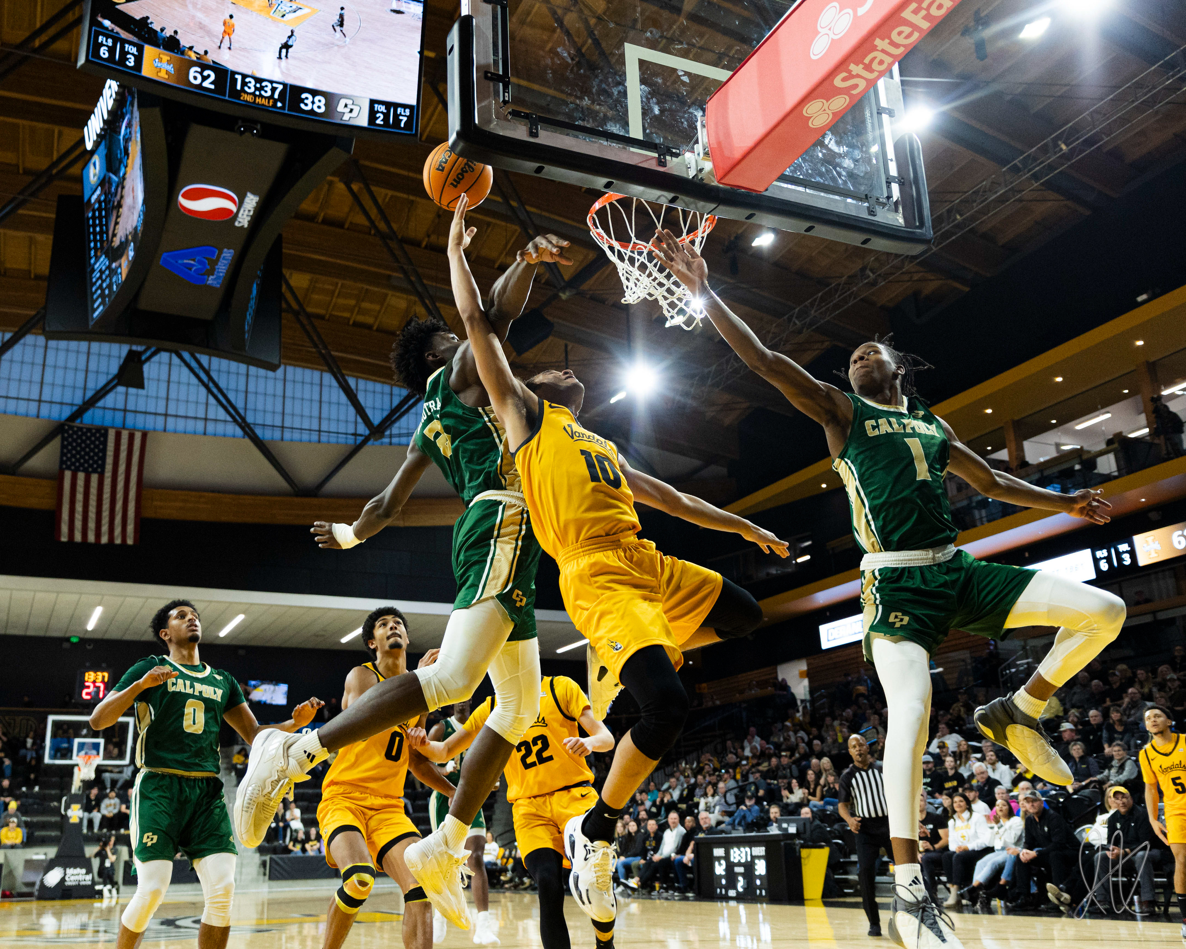 Kristian Gonzalez gets fouled on while going up for a dunk