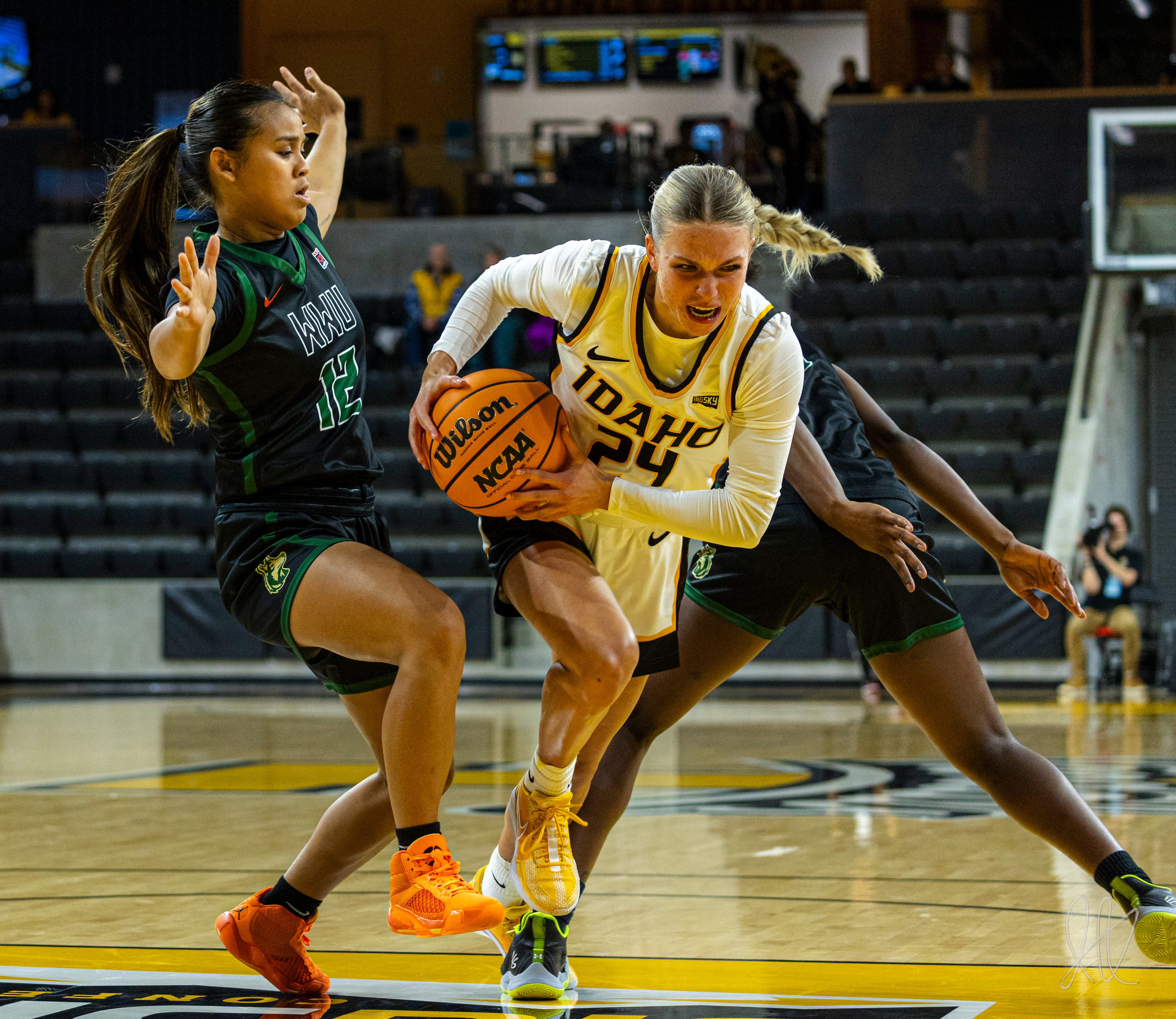 Aspen Caldwell throws defenders off balance while driving towards the net