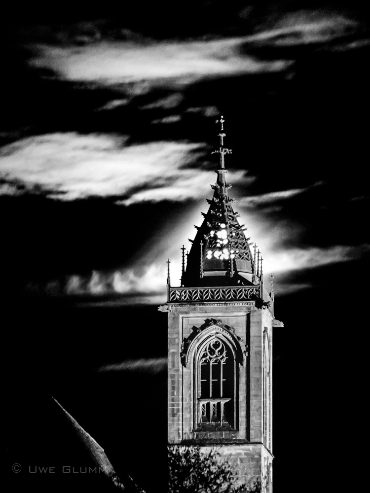 Moon behind church spire St. Jakobus. 2000.