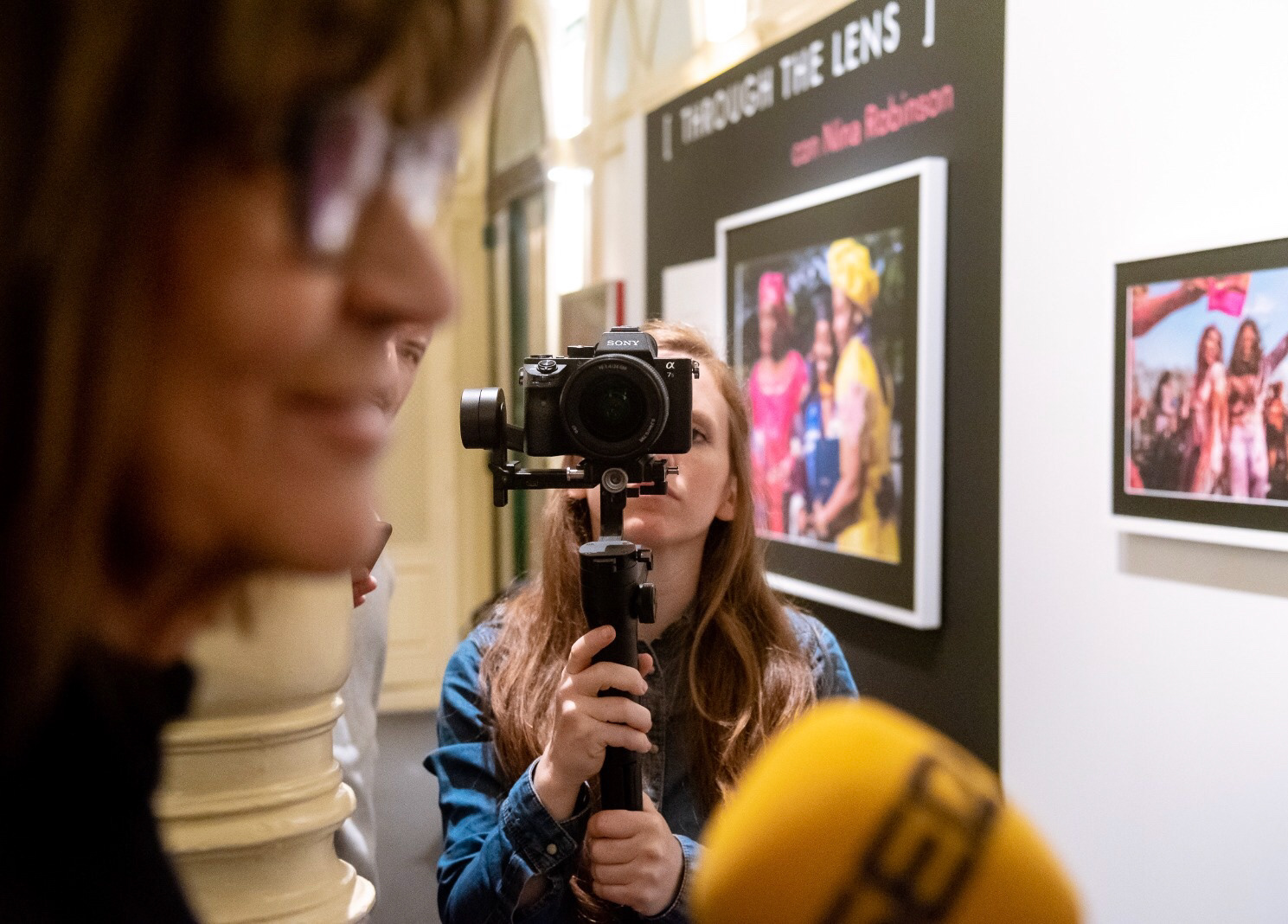 Caitlin O'Rorke filming at National Geographic Women exhibit. Photo by Vanina Romero